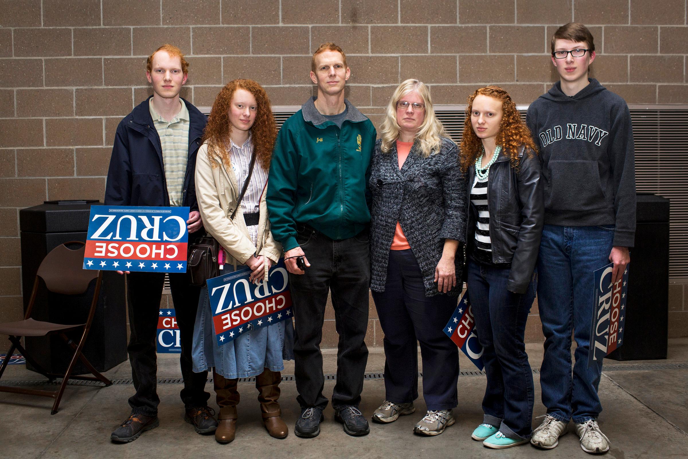 Supporters attend a rally for Ted Cruz in Des Moines, Iowa on Jan. 31, 2016. From left, Joseph, Jennifer, Jeff, Kim, Jessica and Josiah Stilwell pose for a family portrait after the rally. Jeff, the father of the family, said "Ted Cruz is solid in God. He doesn't just say it, or sigh bills, he fights for what he believes. He brings the fight to the battlefield, and that's what we need. He knows he's going to heaven. He's a true Christian. Without God we're nothing. There are absolutely moral wrongs and rights and he's fighting for what's right."