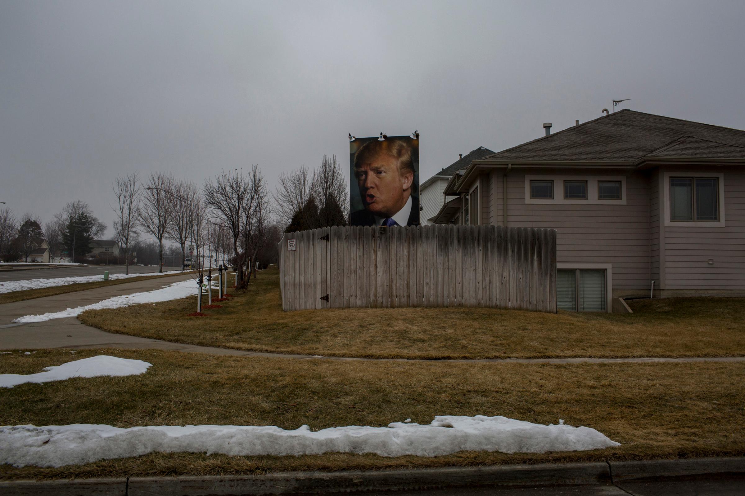 January 25, 2016. Des Moines Iowa. A picture of Donald Trumps face on a fence in West Des Moines. As Iowa's Caucuses approach, candidates converge on the state for campaign events. On Monday evening democratic candidates Clinton, O'Malley and Sanders held a Town Hall sponsored by CCN at Drake University in Des Moines. (Natalie Keyssar)