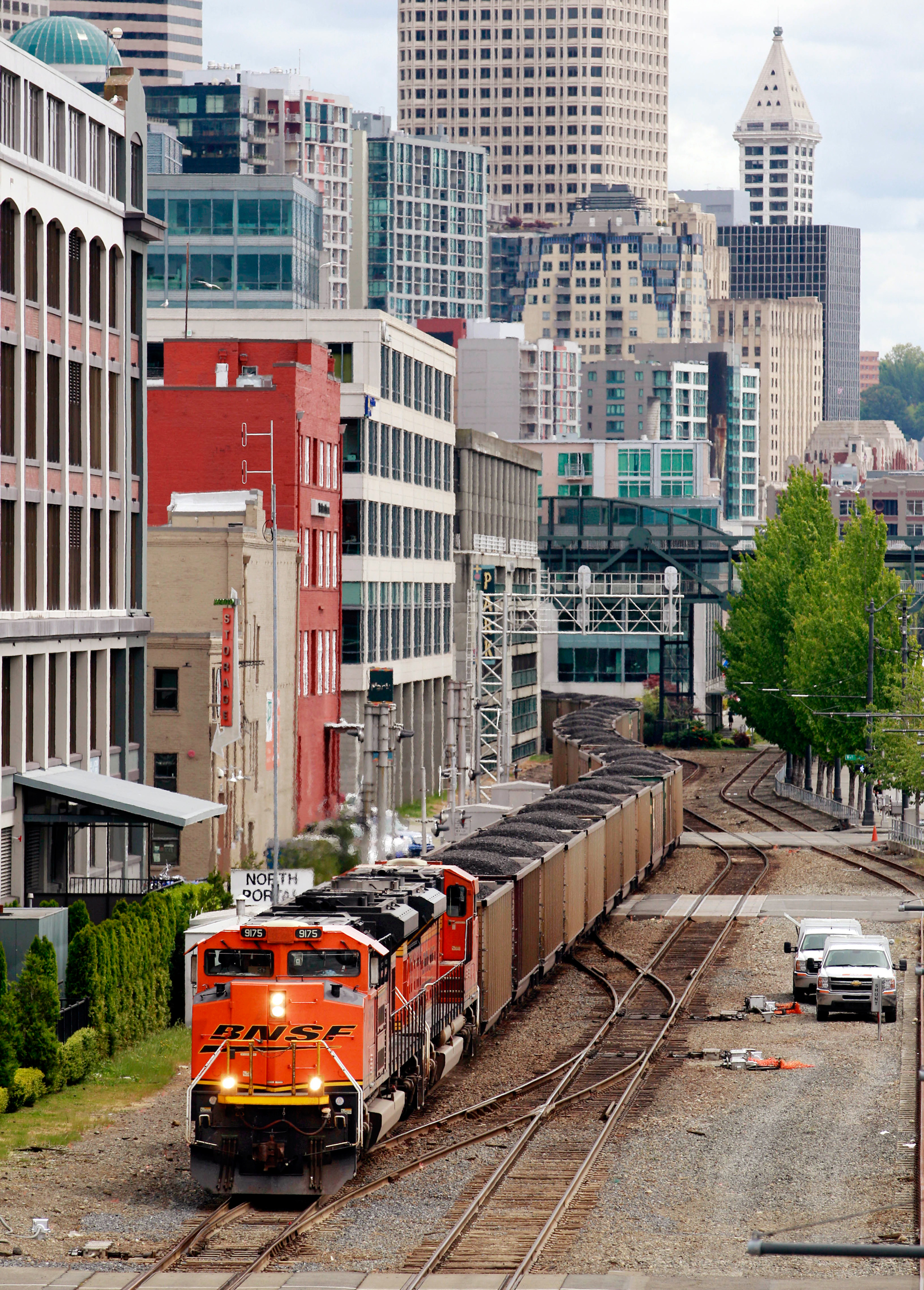 A train hauls coal bound for Canada through downtown Seattle