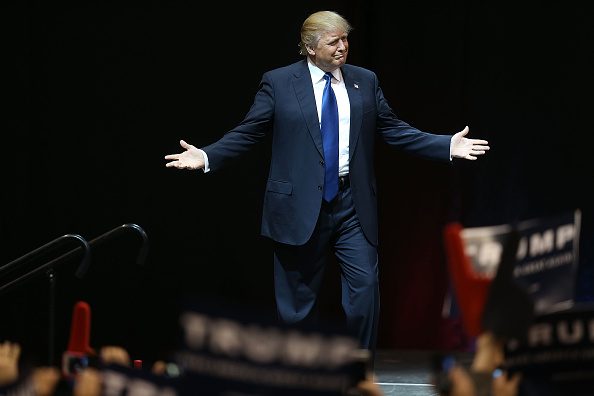 Republican presidential candidate Donald Trump arrives on stage during a campaign rally at Verizon Wireless Arena in Manchester, New Hampshire, on Feb. 8, 2016.