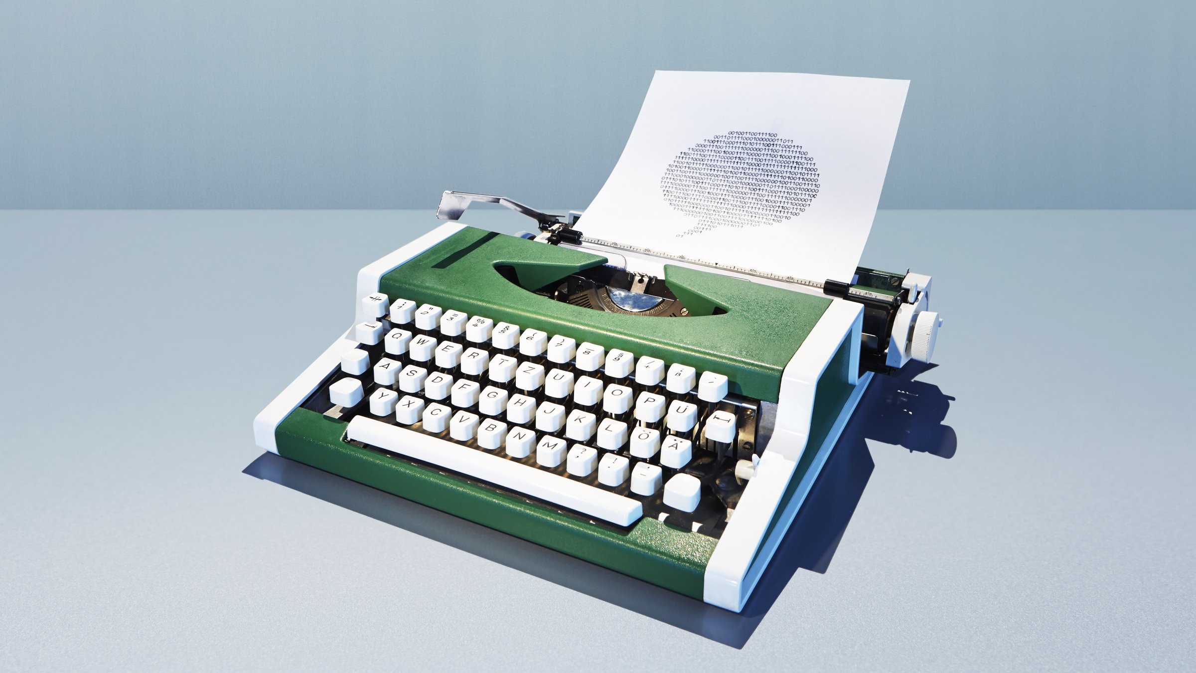 Typewriter with bubble of binary digits