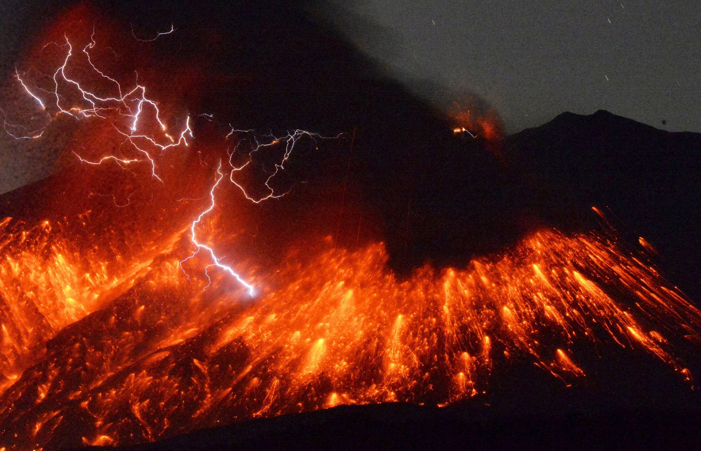 Volcanic lightning is seen at an eruption of Mount Sakurajima from Tarumizu city in southwestern Japan on Feb. 5, 2016. A Japanese volcano about 30 miles from a nuclear plant erupted on Friday, Japan's Meteorological Agency said, sending fountains of lava into the night sky.