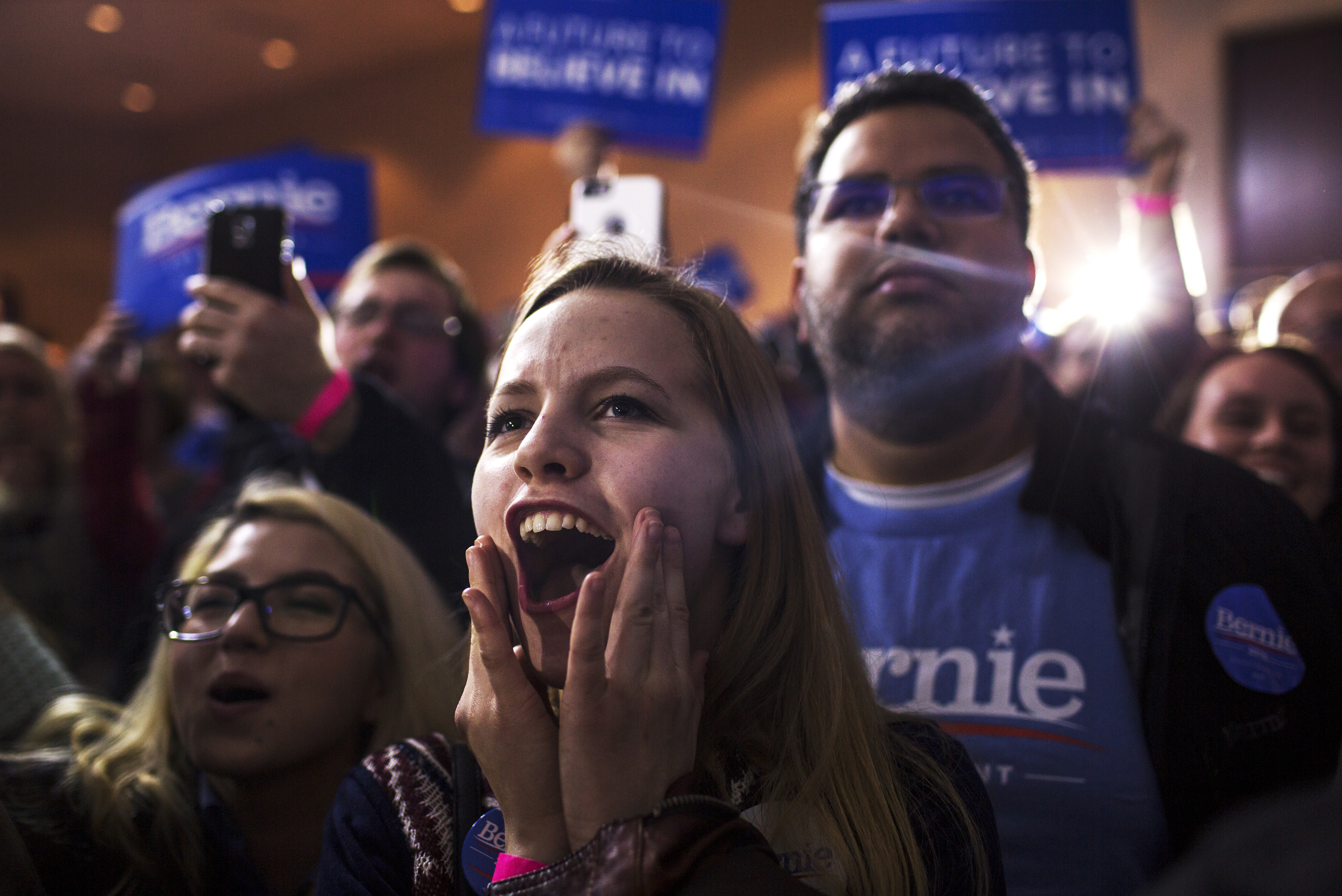 Supporters react during a caucus night party for Democratic presidential candidate, Vermont Sen. Bernie Sanders in Des Moines, Iowa on Feb. 1, 2016.