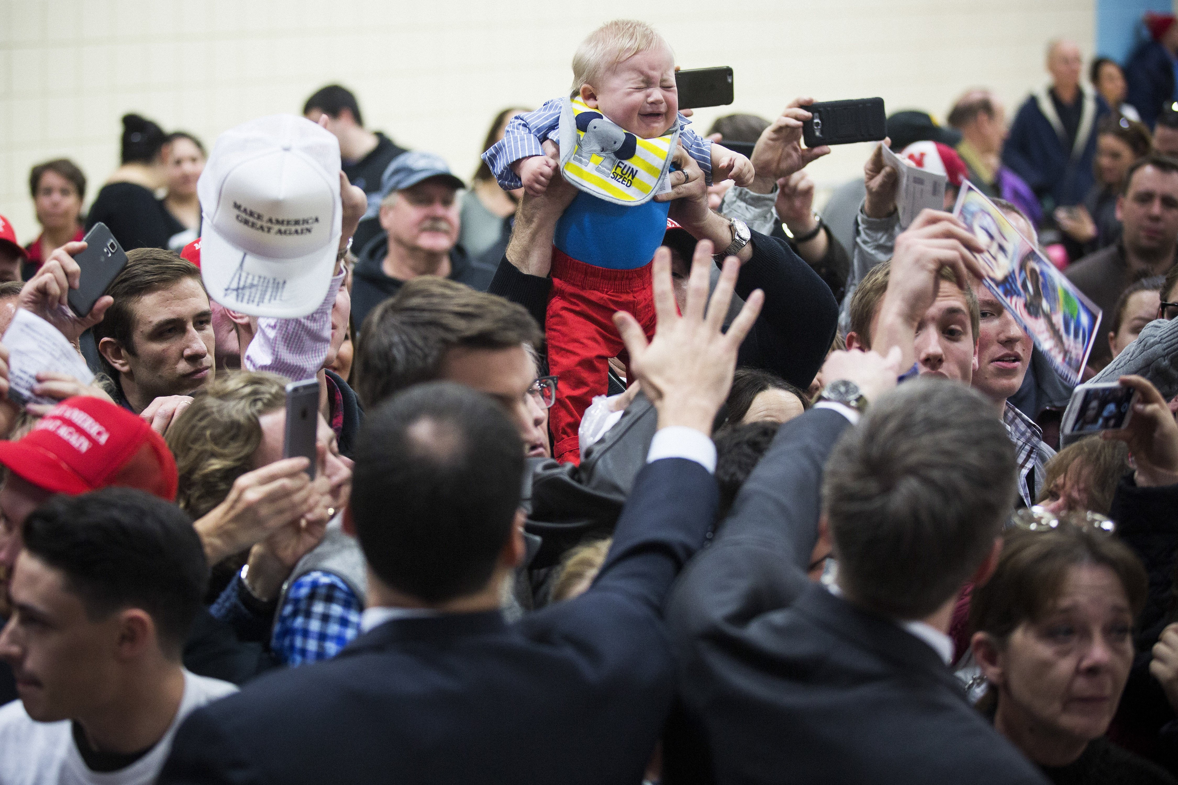 Supporters wait to greet Republican presidential candidate Donald Trump during a campaign event in Council Bluffs, Iowa, on Jan. 31, 2016.