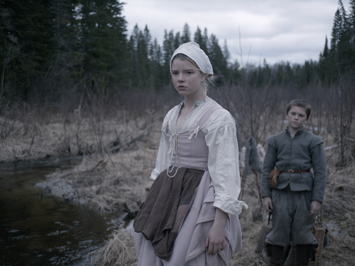 This photo provided by courtesy of A24 shows Anya Taylor-Joy, left, as Thomasin, and Harvey Scrimshaw as Caleb in a scene from the film, 