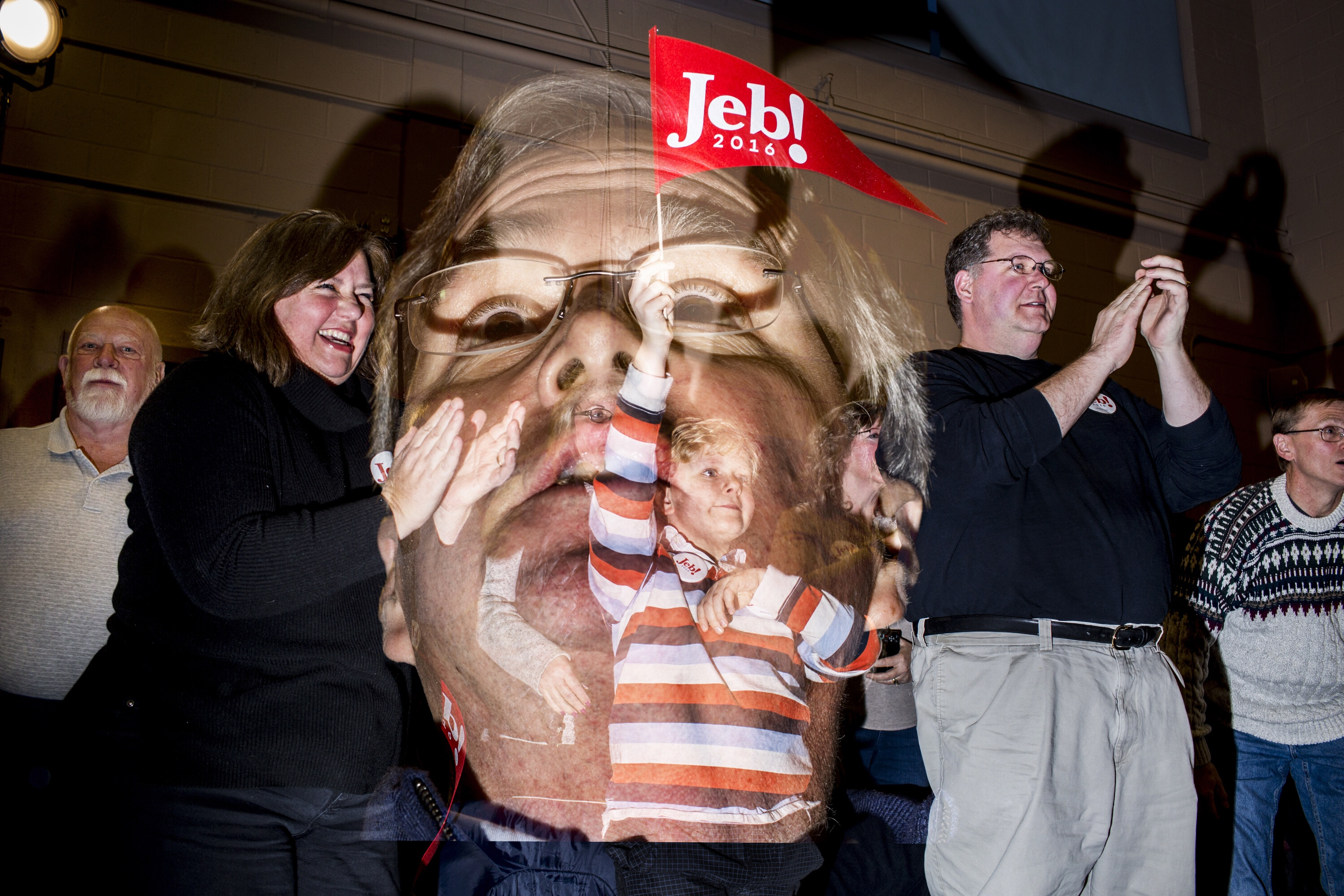 This double exposure image shows Republican presidential candidate Jeb Bush speaking to attendees at a town hall meeting in Pelham, N.H. on Jan 23, 2016.