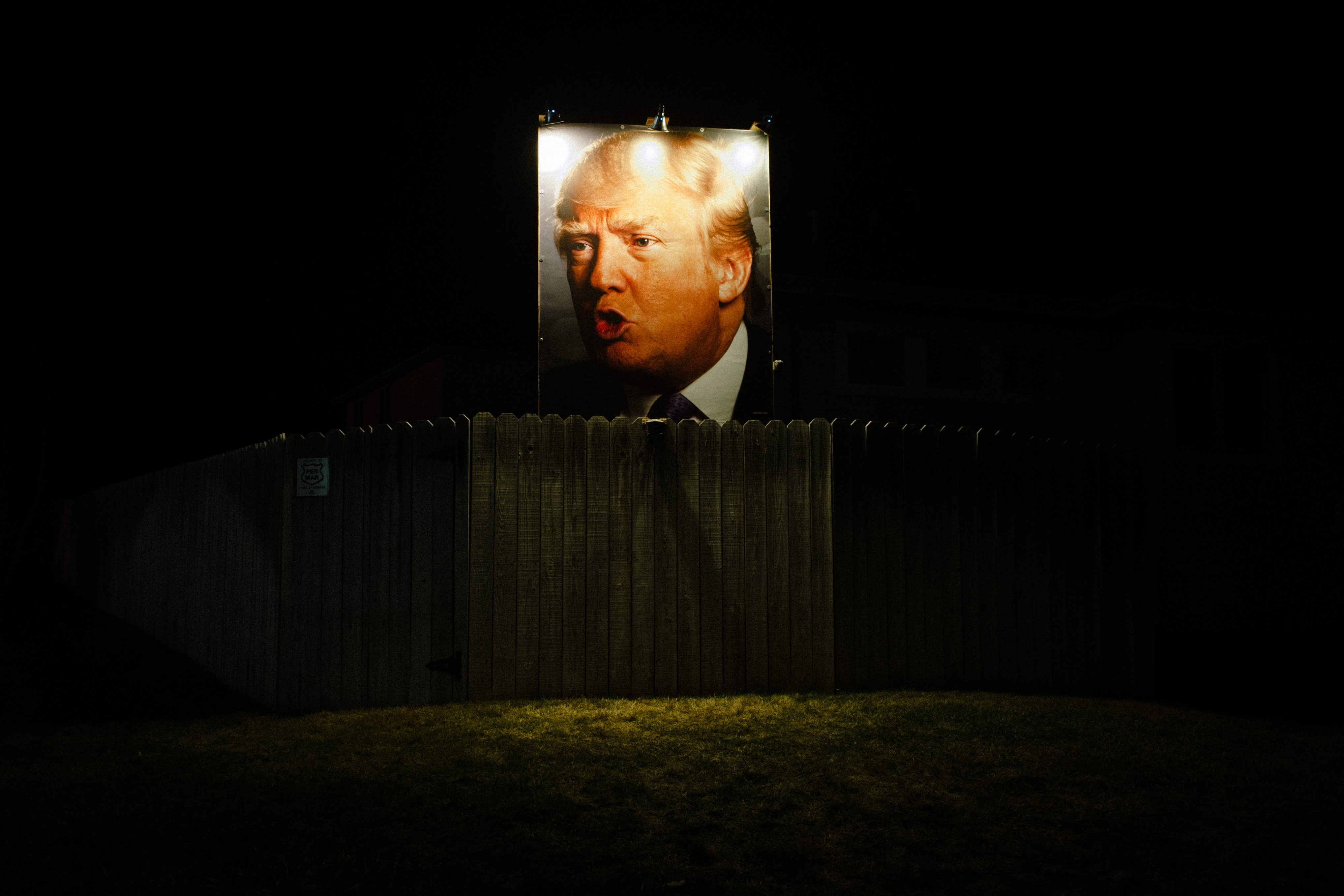 A poster depicting Republican presidential candidate Donald Trump is displayed at the home of George Davey, on Jan. 14, 2016 in Des Moines, Iowa.