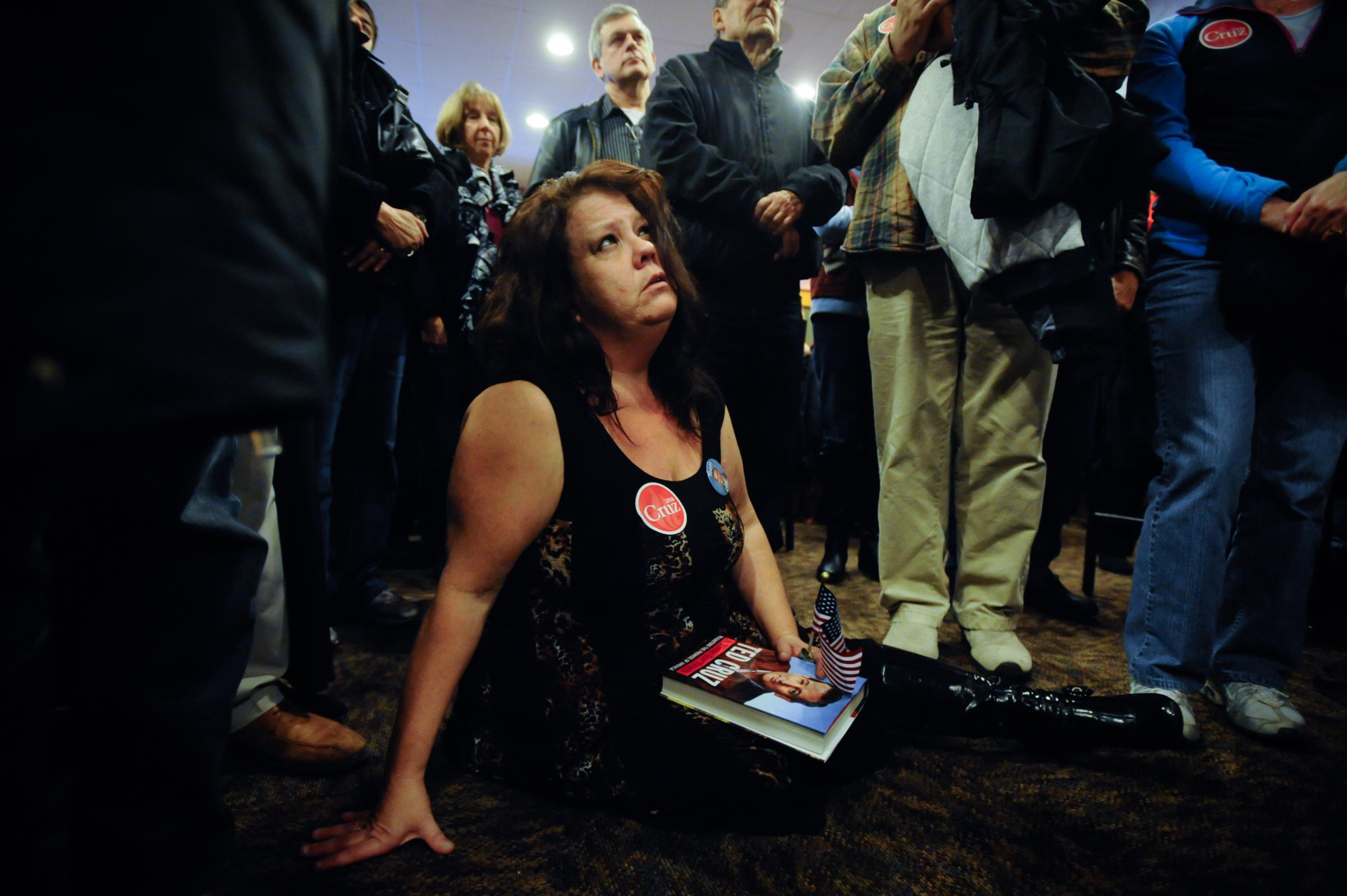 Iowan Debra Sage, a supporter of Republican presidential candidate Ted Cruz, listens as Cruz speaks at a campaign stop at a Pizza Ranch restaurant in Newton, Iowa Nov. 29, 2015.