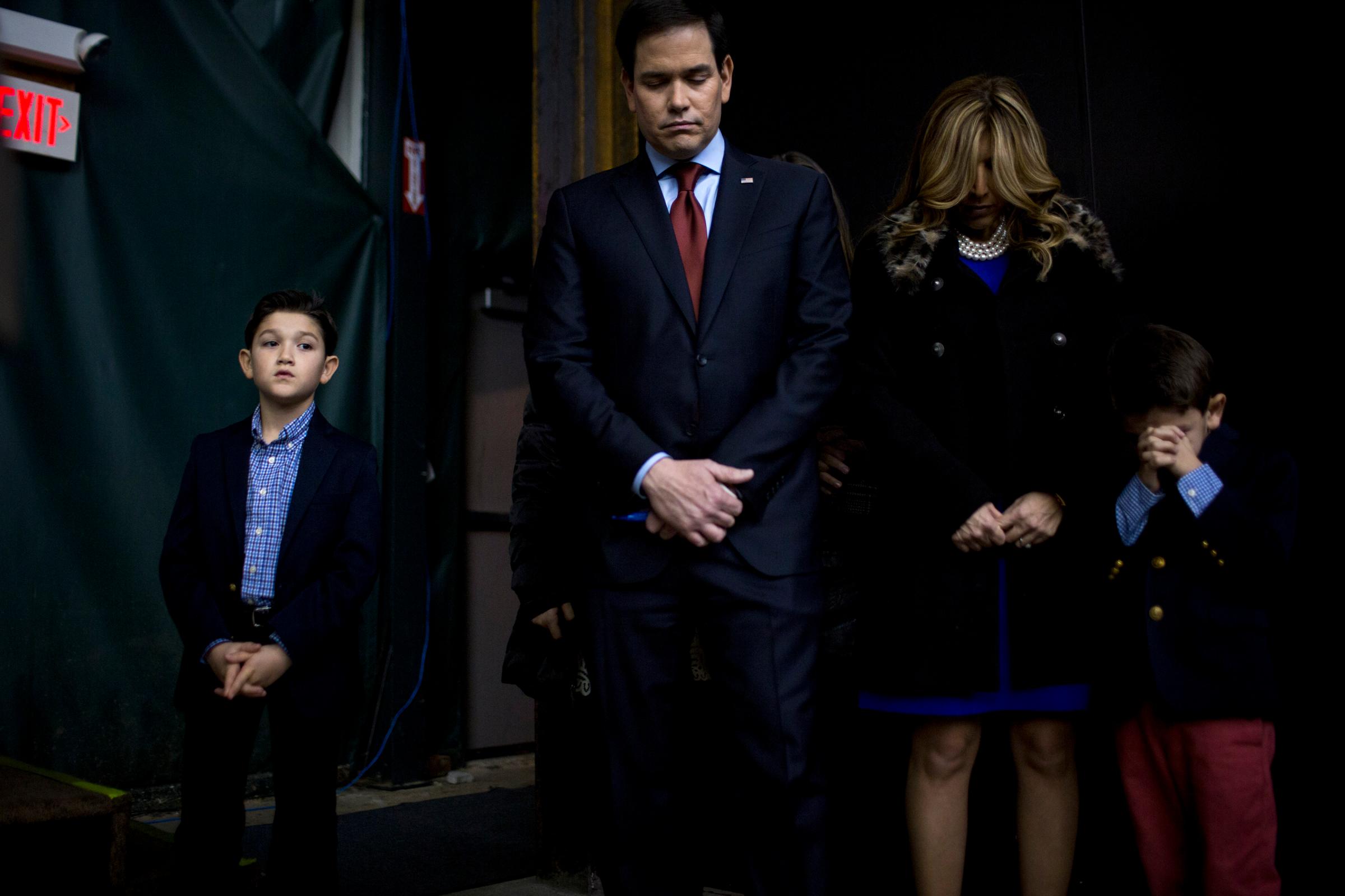 Republican presidential candidate Marco Rubio appears with his family at his caucus location on Feb. 1, 2016, in Clive, Iowa.