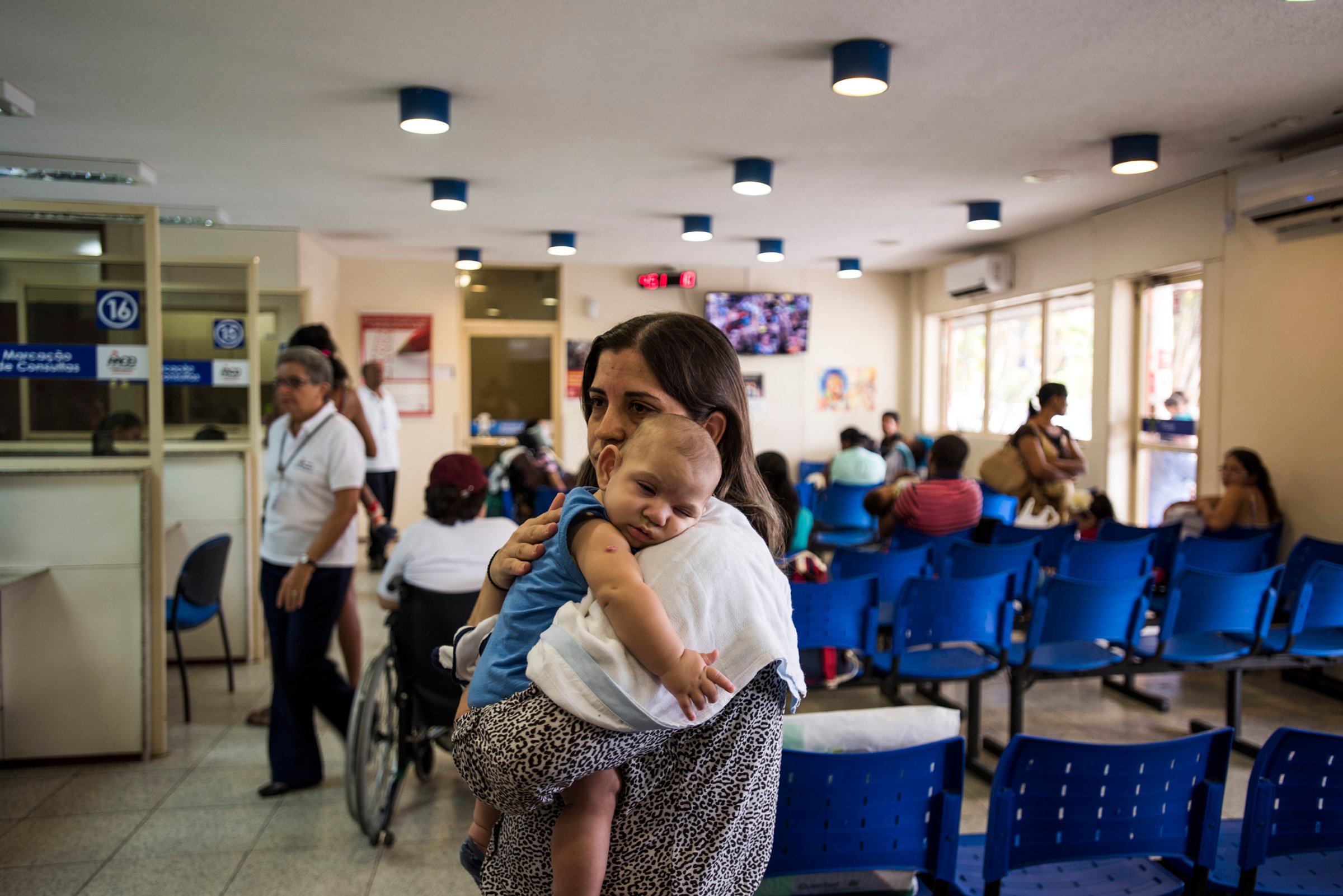 Isabel Albuquerque and her son in the waiting room of Associacao de Assistencia a Crianca Deficiente, a rehabilitation center for disabled children, in Recife, Brazil, Feb. 1, 2016.