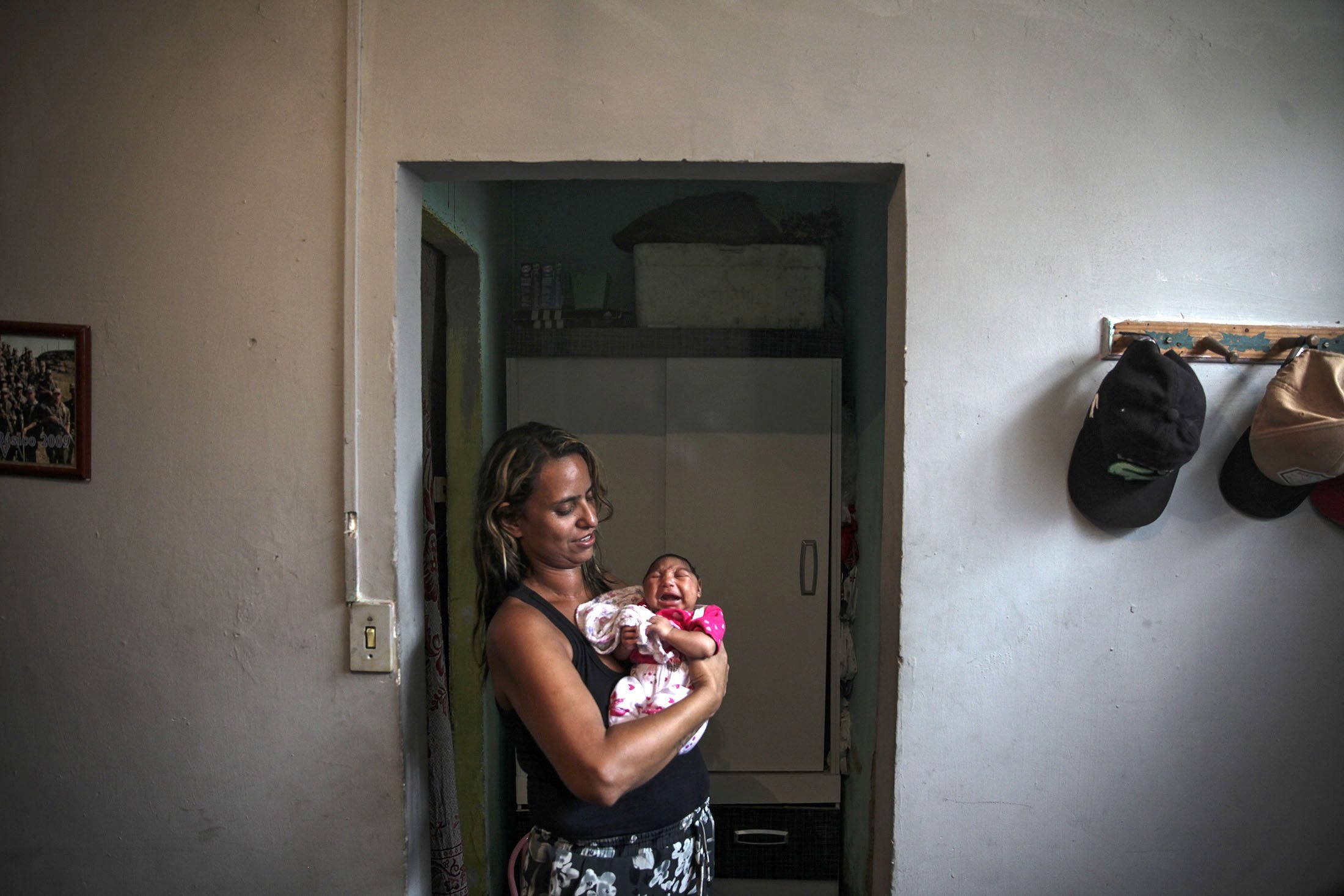 Patricia Vieira de Araujo holds her one-month-old granddaughter Manuelly Araujo da Cruz, who was born with microcephaly after being exposed to the zika virus during her mother's pregrnacy, in Rio de Janeiro, Brazil, Feb. 12, 2016. (Antonio Lacerda—EPA)