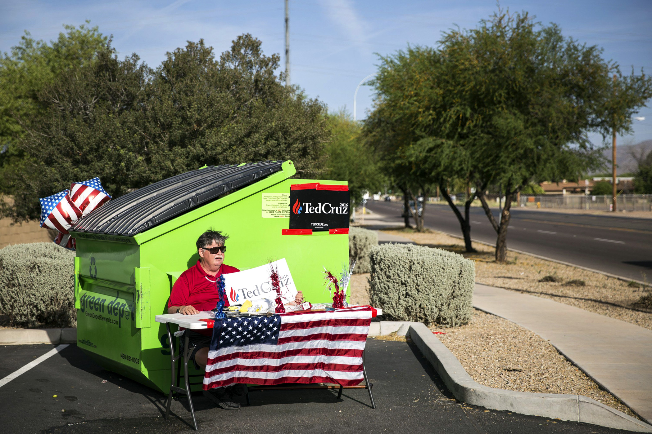 Phillip Ramsdell, a supporter of Texas Sen. Ted Cruz, campaigns near a polling place in the Laveen Village neighborhood of Phoenix on March 22.