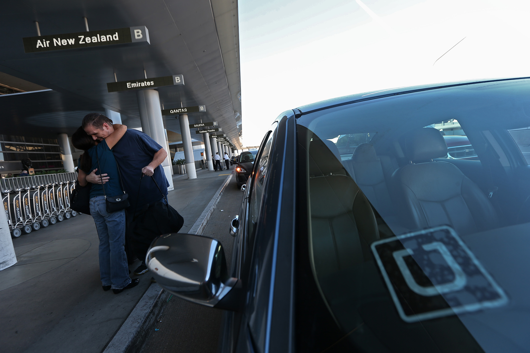 An Uber driver drops off a passenger at LAX, October 20, 2015.
