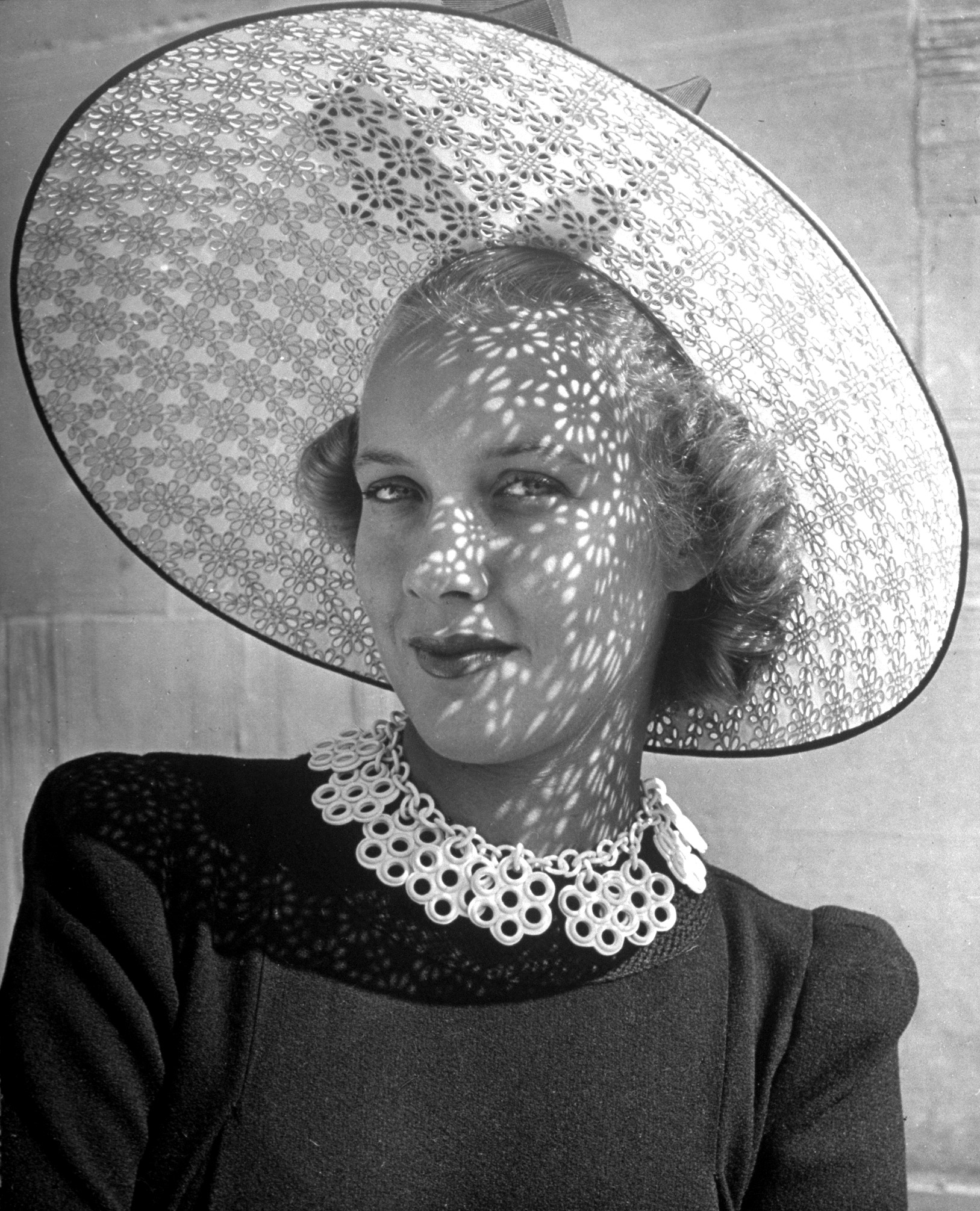 Revival of eyelet embroidery with a punched hole hat and necklace. 1940.
