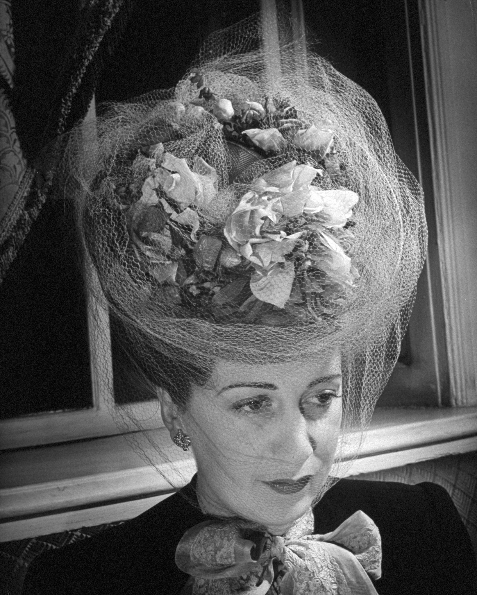 Lady wearing an extravagant hat. 1945.