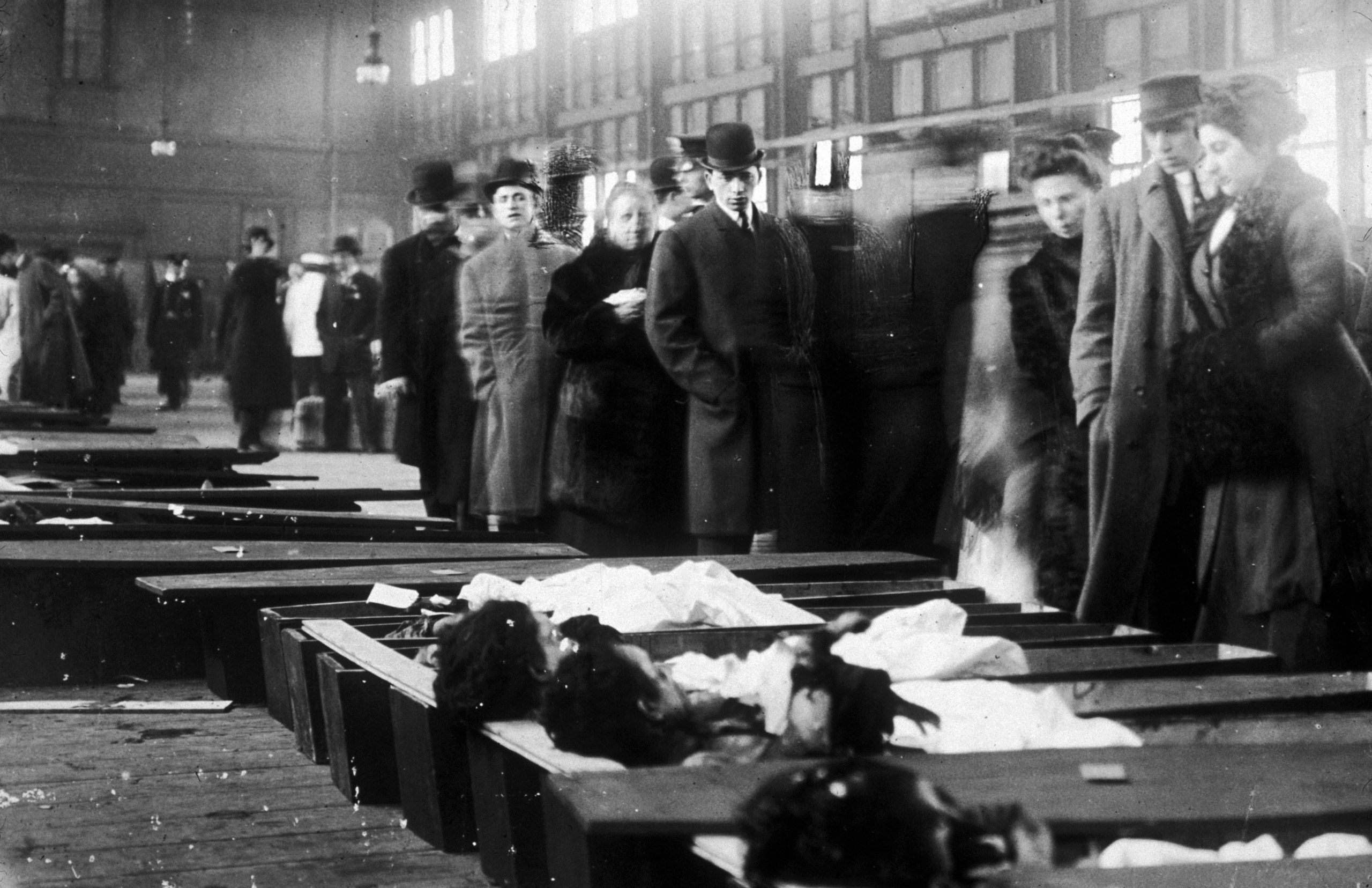 People line up to identify the bodies of victims after a fire at the Triangle Shirtwaist Company in New York, March 25, 1911.