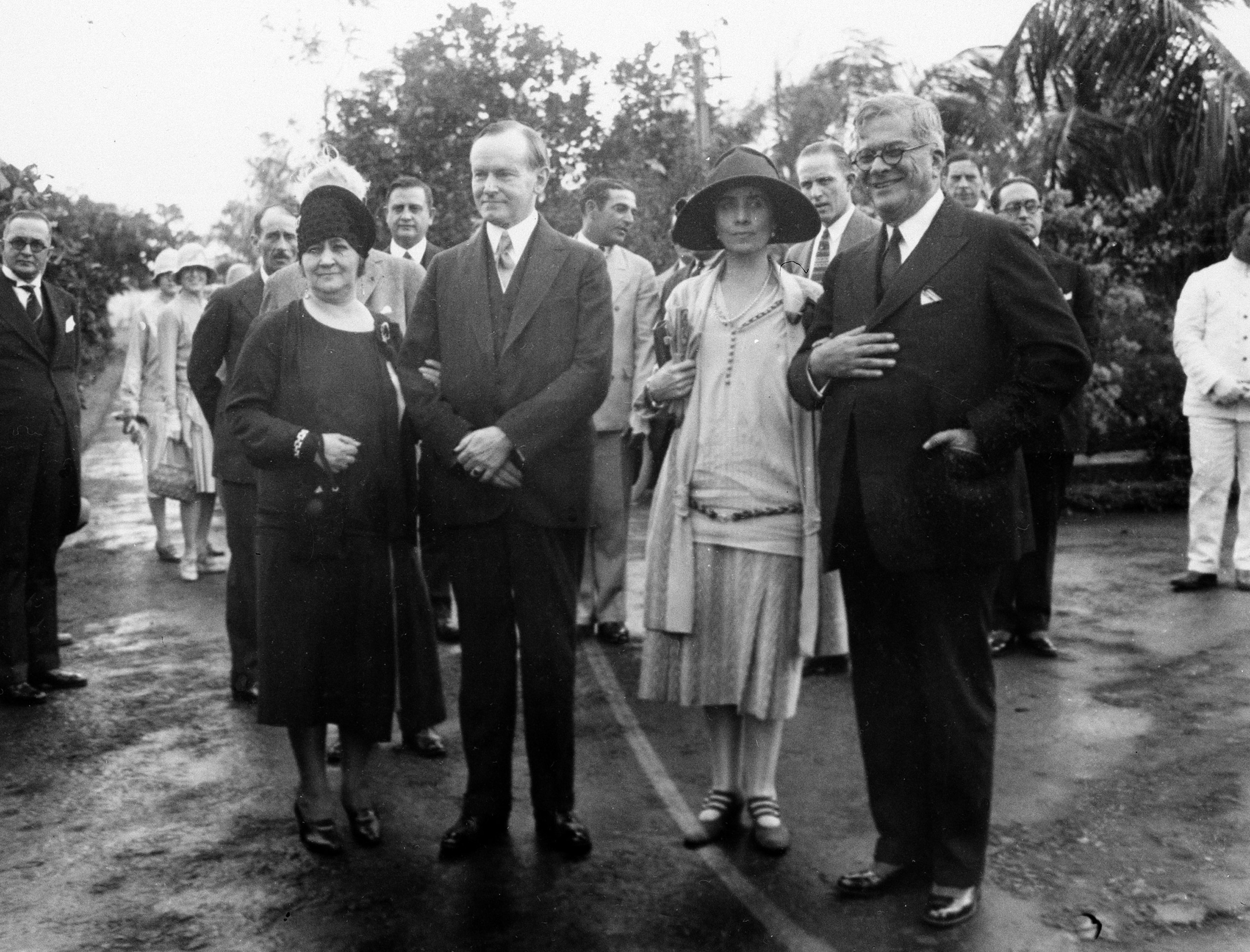 U.S. President Calvin Coolidge, second from left, and his wife, first lady Grace Coolidge, third from left, are shown with the President of Cuba General Gerardo Machado y Morales, right, and his wife, Elvira Machado, left, on the estate of President Machado in Havana, Cuba, Jan. 19, 1928. (AP Photo)