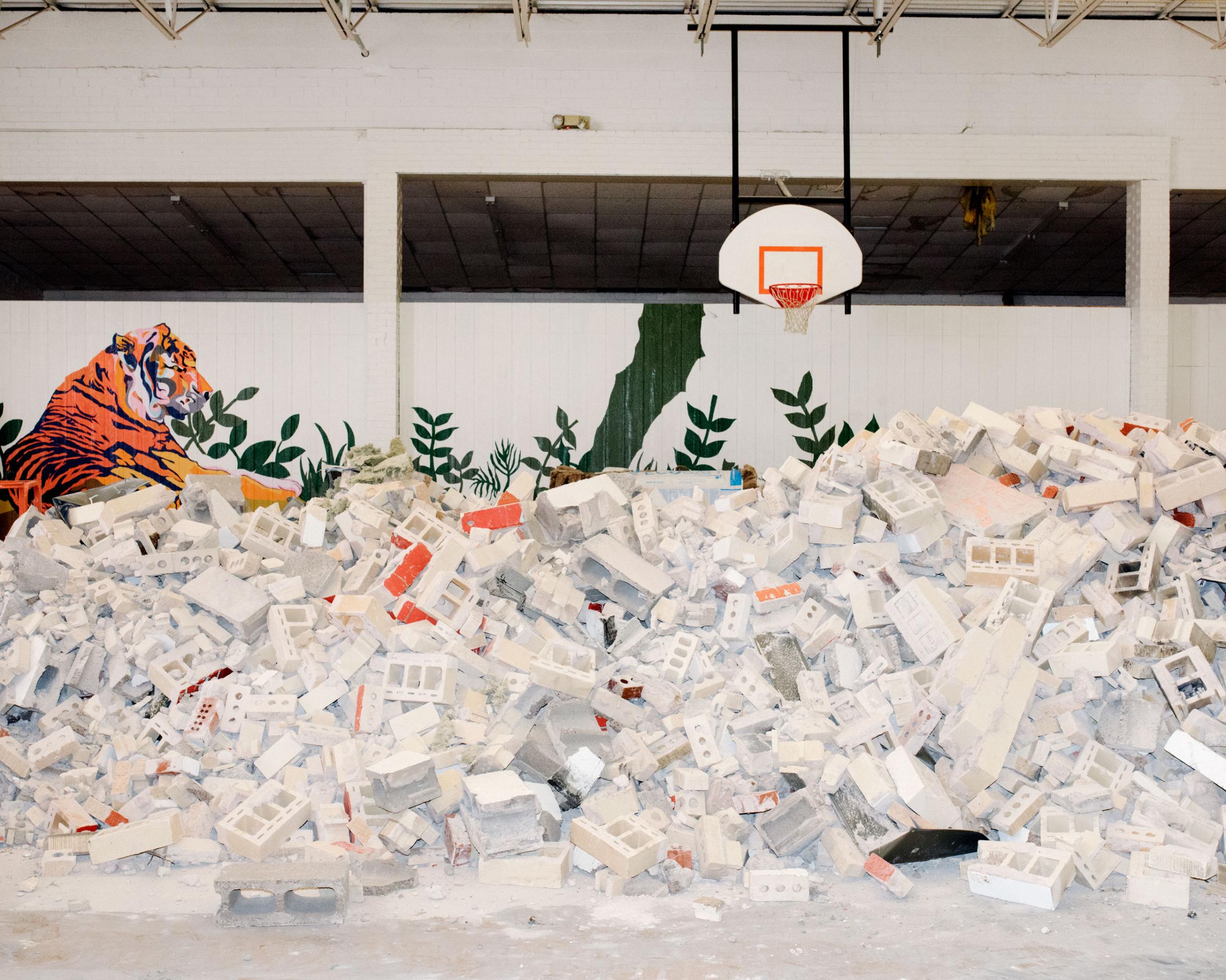 Cinder blocks left from demolition are piled in Crescent High School’s gymnasium. An earthquake on July 28, 2015 destabilized the gymnasium’s walls forcing the school to repair the entire structure, Crescent, OK