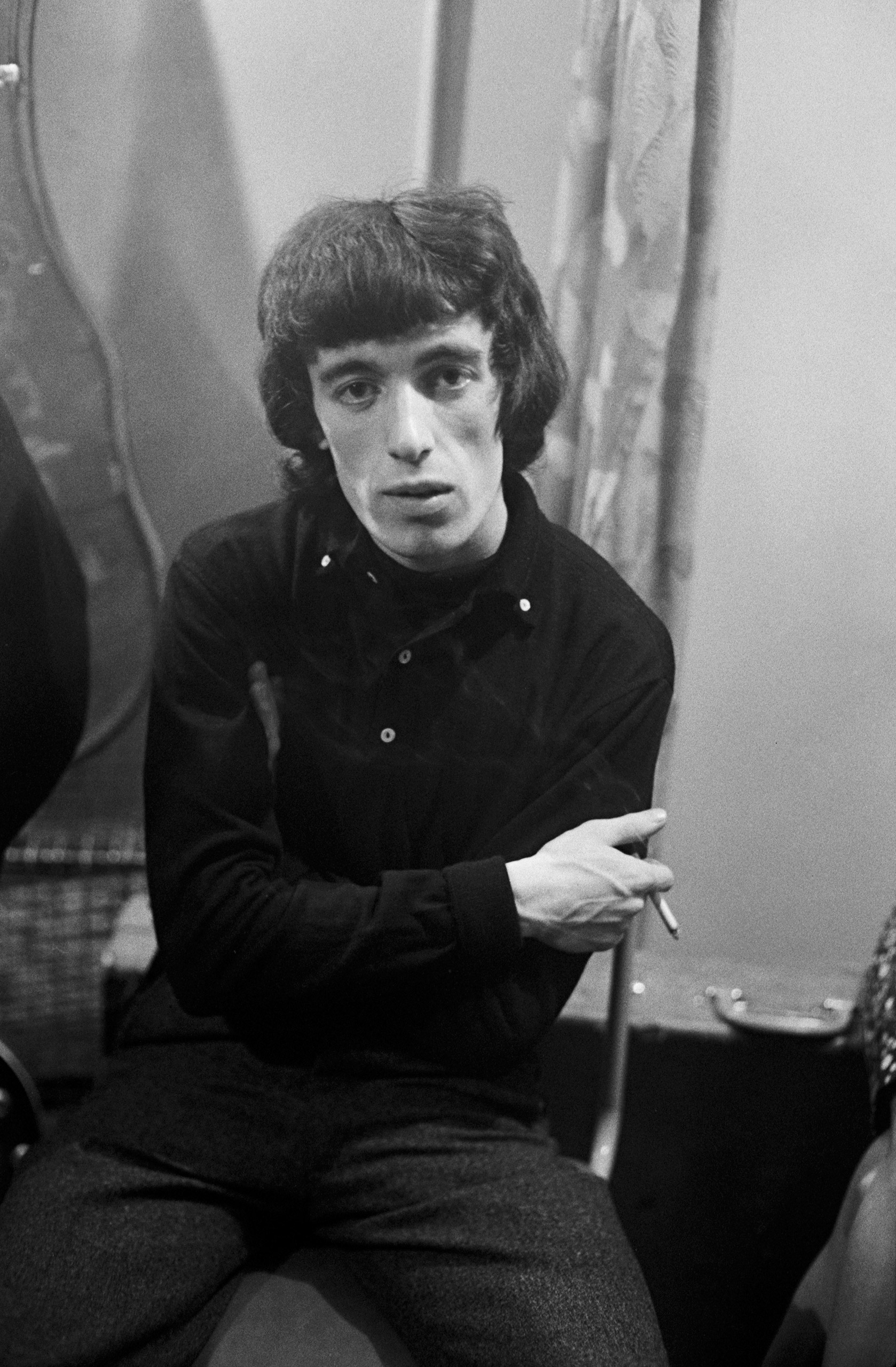 Bill Wyman, bassist for The Rolling Stones backstage in 1964.