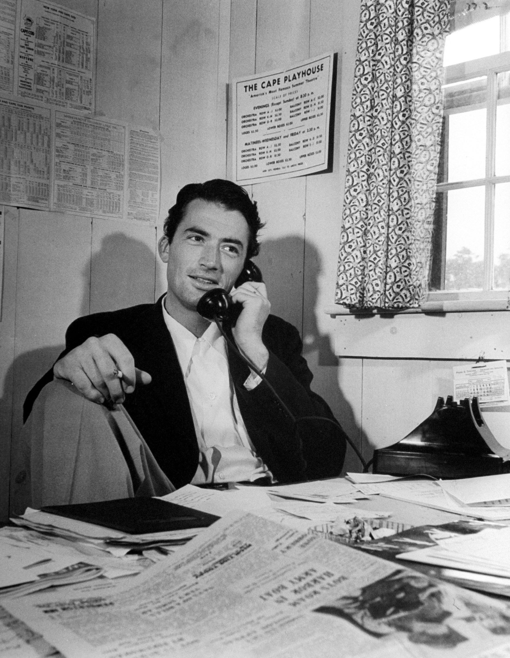 Gregory Peck talking on the telephone during summer stock in Cape Cod, 1946.