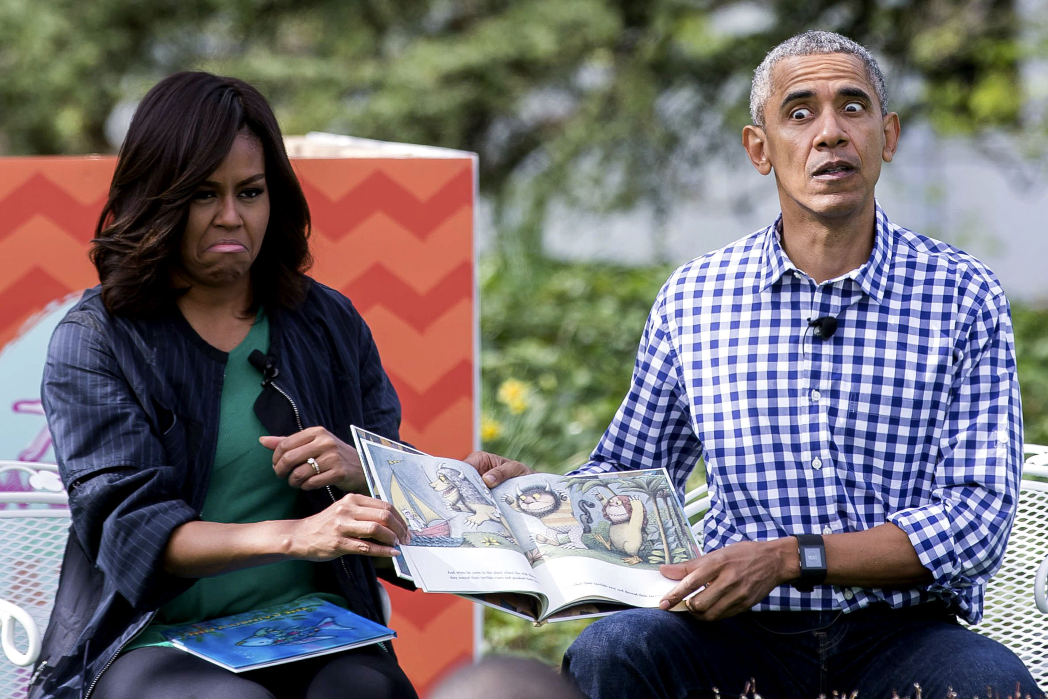 President Barack Obama and First Lady Michelle Obama read the book "Where the Wild Things Are" to a group of children during the 138th annual White House Easter Egg Roll in Washington on March 28, 2016.