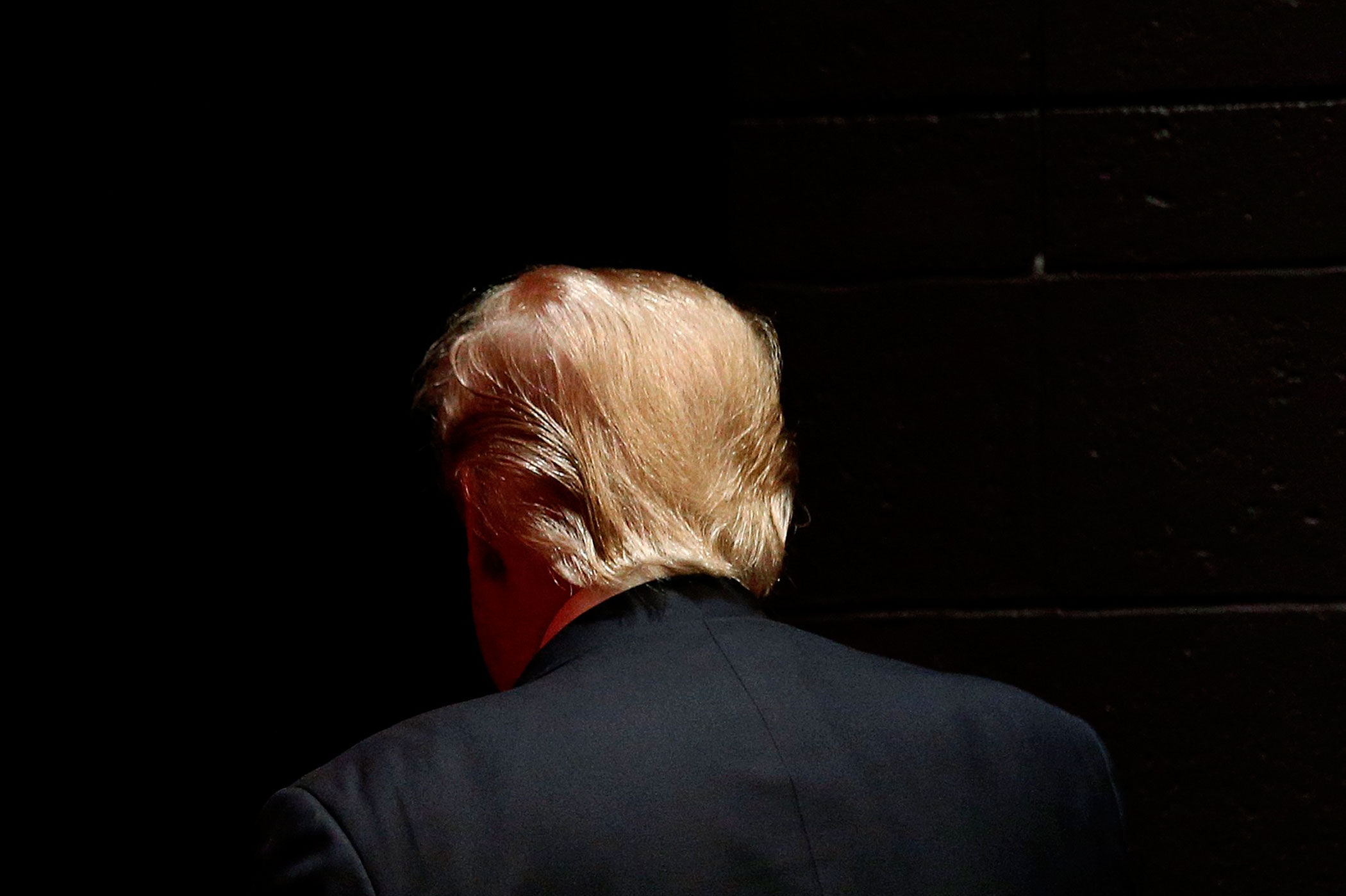 Republican presidential candidate Donald Trump walks off stage after speaking at a campaign event at St. Norbert College in De Pere, Wis., on March 30, 2016.