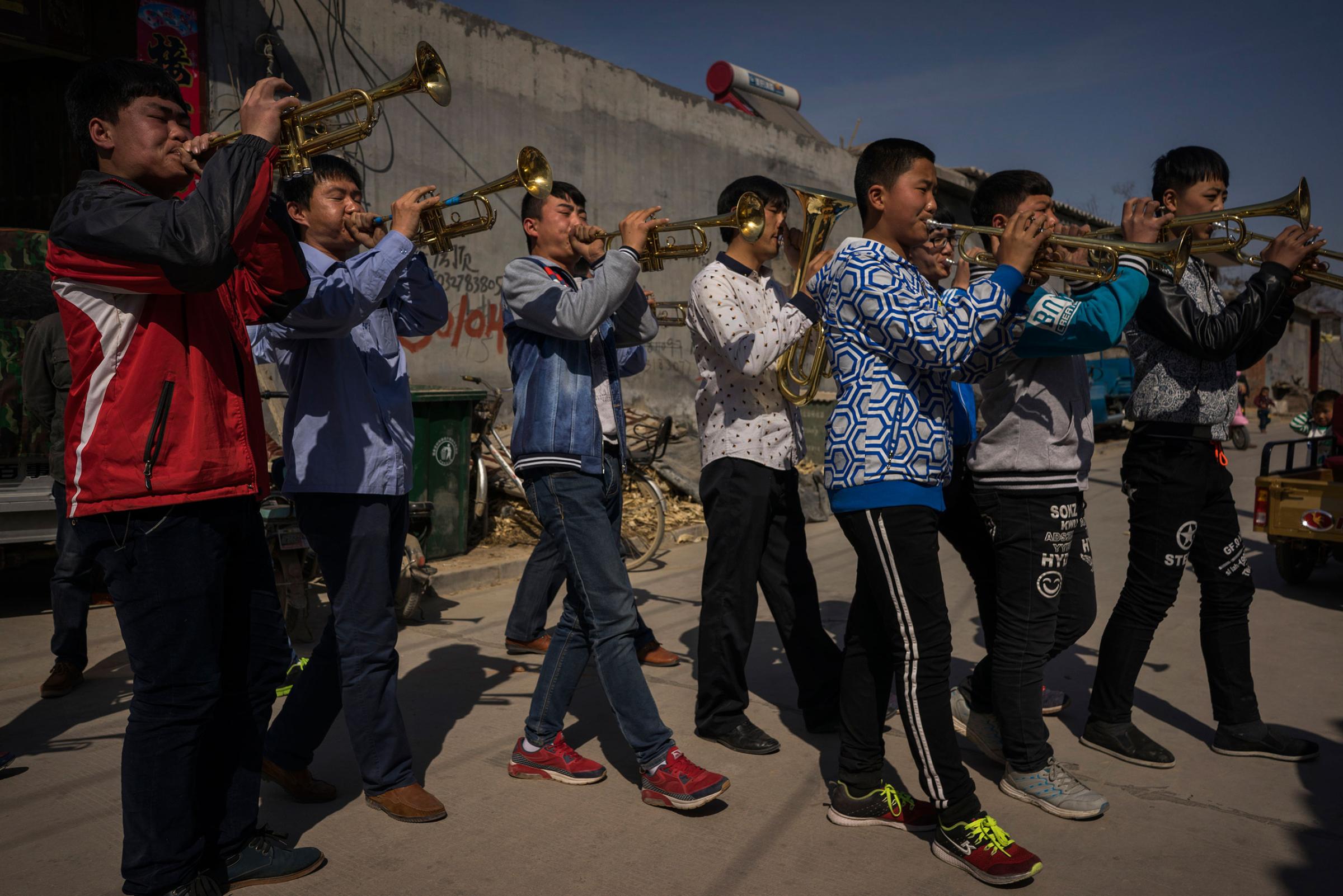 A band plays ahead of an underground Easter Sunday Mass led by dissident Catholic Priest Dong Baolu in the yard of his house in Youtong village, Shijiazhuang, China, March 27, 2016.