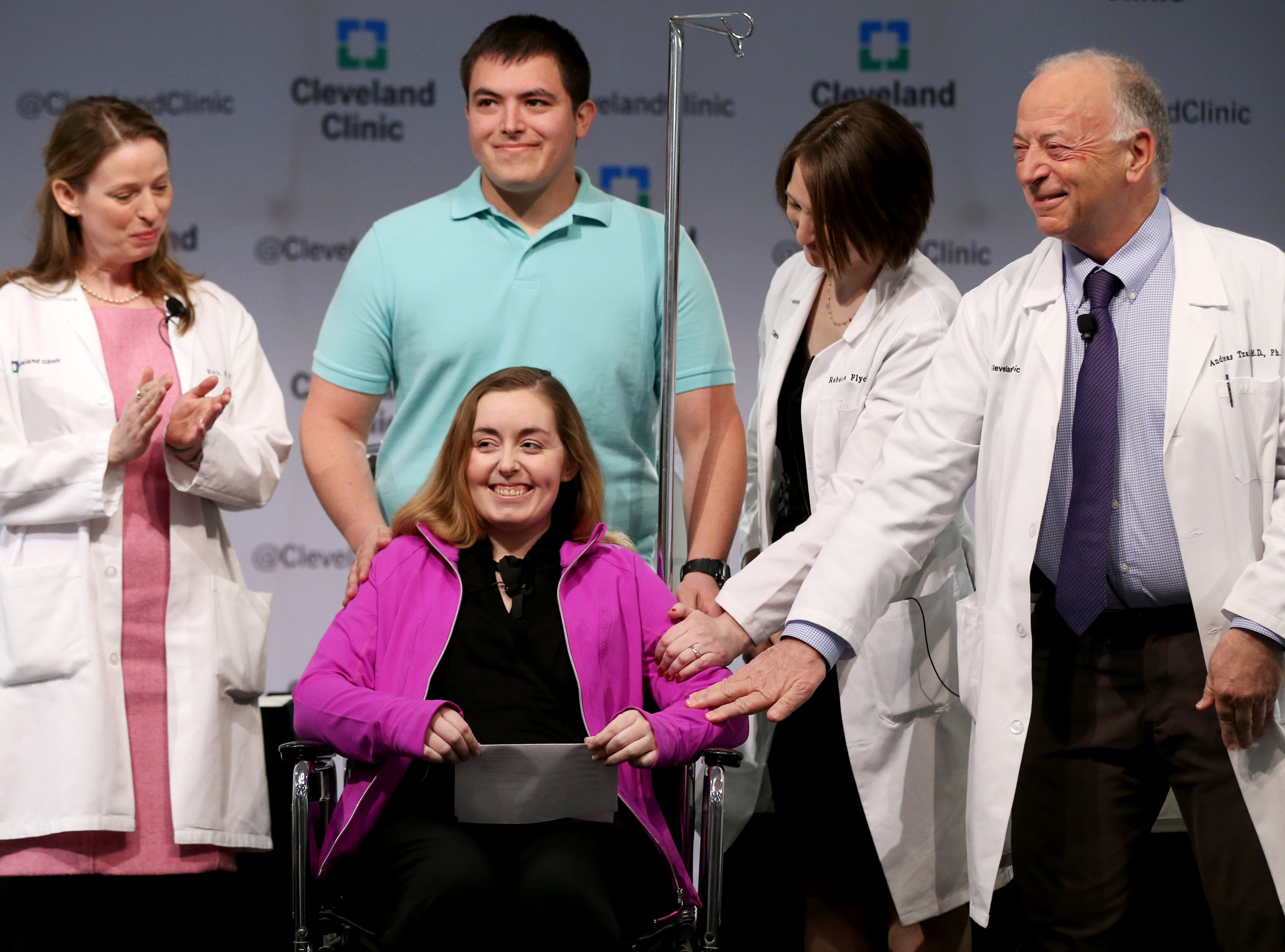 Lindsey and her husband Blake stand with Cleveland Clinic medical staff as they announce she was the nation's first uterus transplant patient, March 7, 2016, in Cleveland, Ohio (Marvin Fong—AP)
