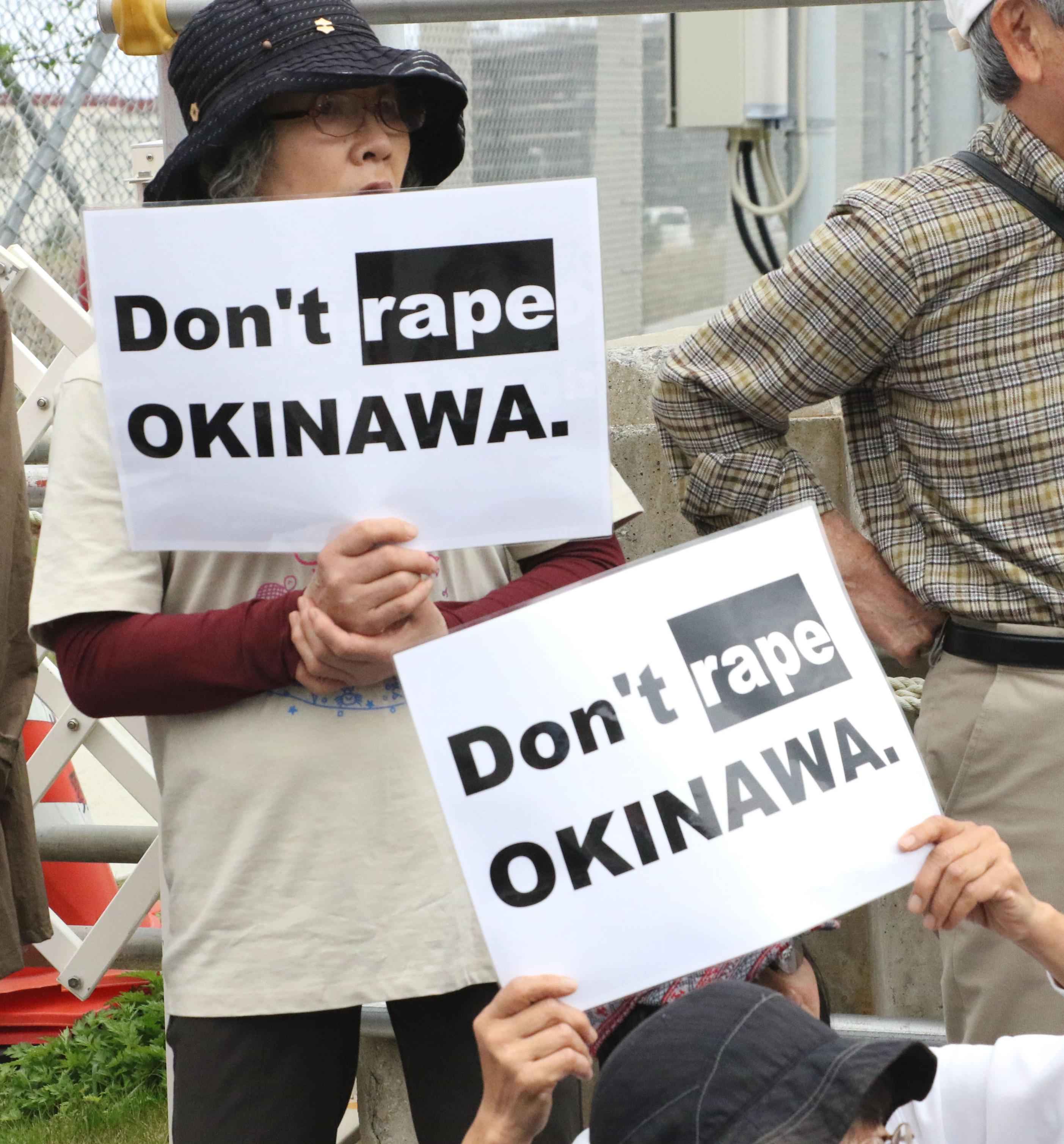 People protest the alleged rape of a female tourist by a U.S. serviceman in front of the U.S. Marine Corps' Camp Schwab in Nago, Okinawa Prefecture, on March 21, 2016. (Kyodo—AP)