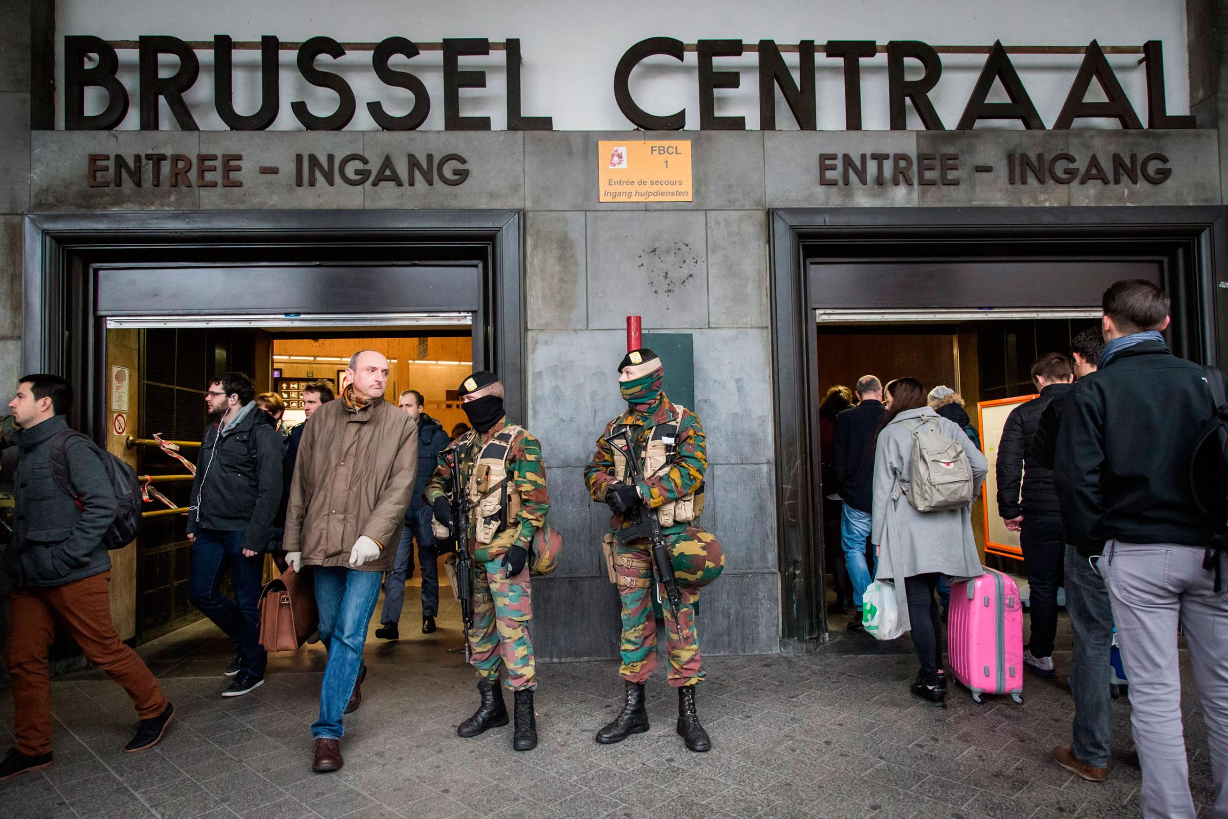Soldiers stand guard at the entrance of central station, one day after the terrorist attacks killed at least 31 people, in Brussels, Belgium, March 23, 2016.