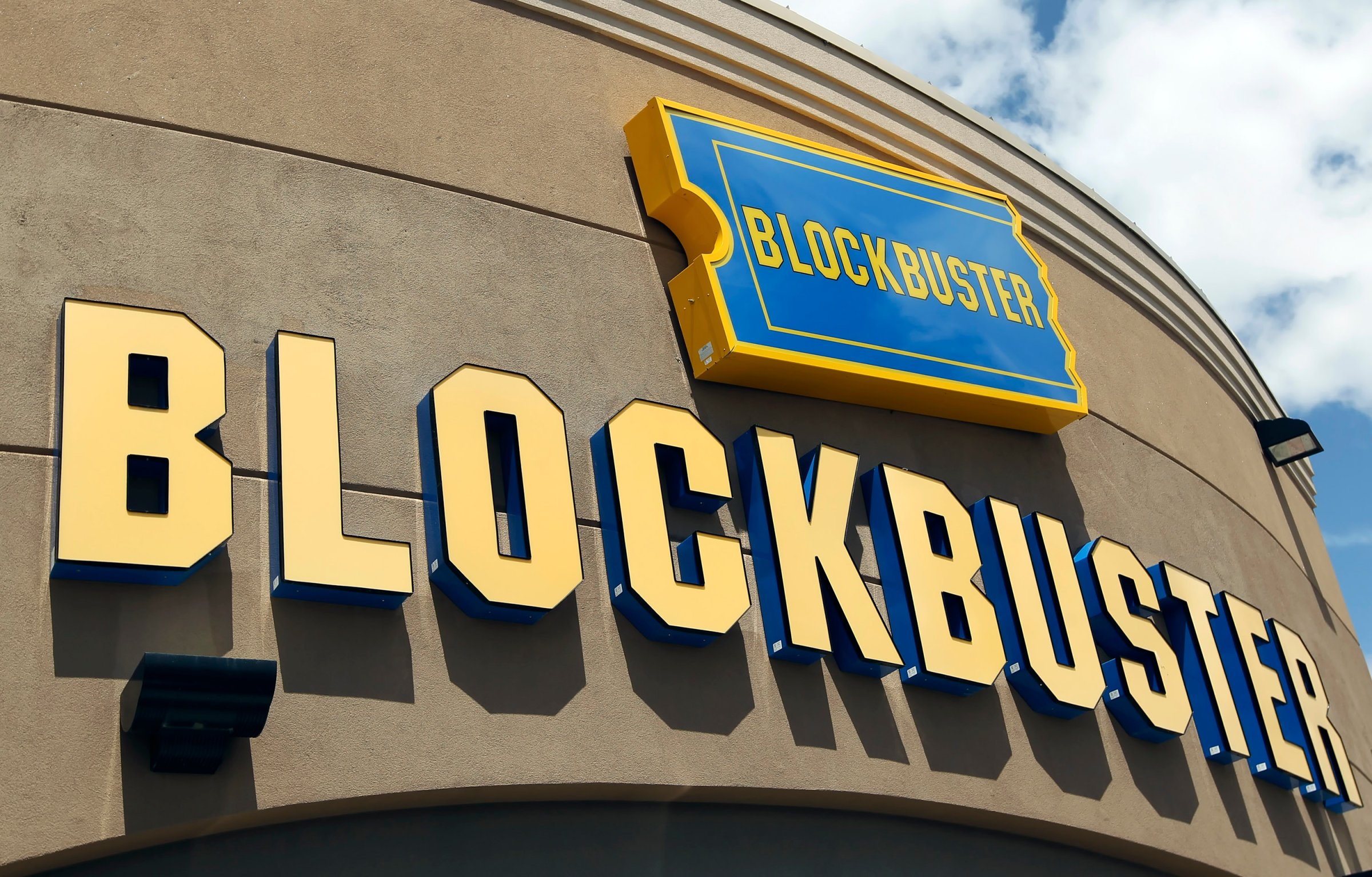 Signage hangs outside a Blockbuster store in Salt Lake City, Utah, U.S., on Wednesday, May 12, 2010.