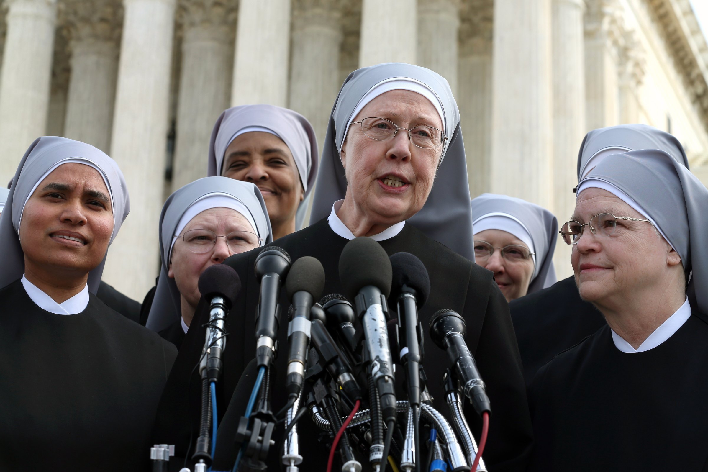 Mother Loraine Marie Maguire, (L), of the Little Sisters of the Poor, speaks to the media after arguments at the U.S. Supreme Court, in Washington, D.C., on March 23, 2016.