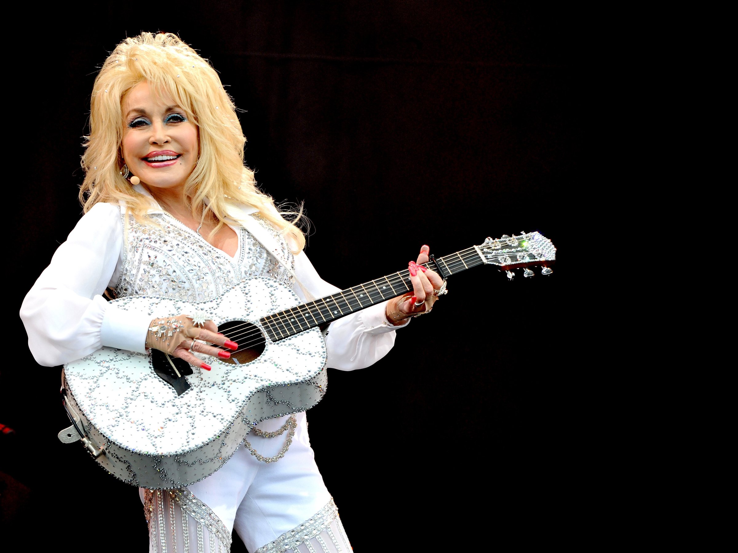 Dolly Parton performs on The Pyramid Stage on Day 3 of the Glastonbury Festival at Worthy Farm on June 29, 2014 in Glastonbury, England.