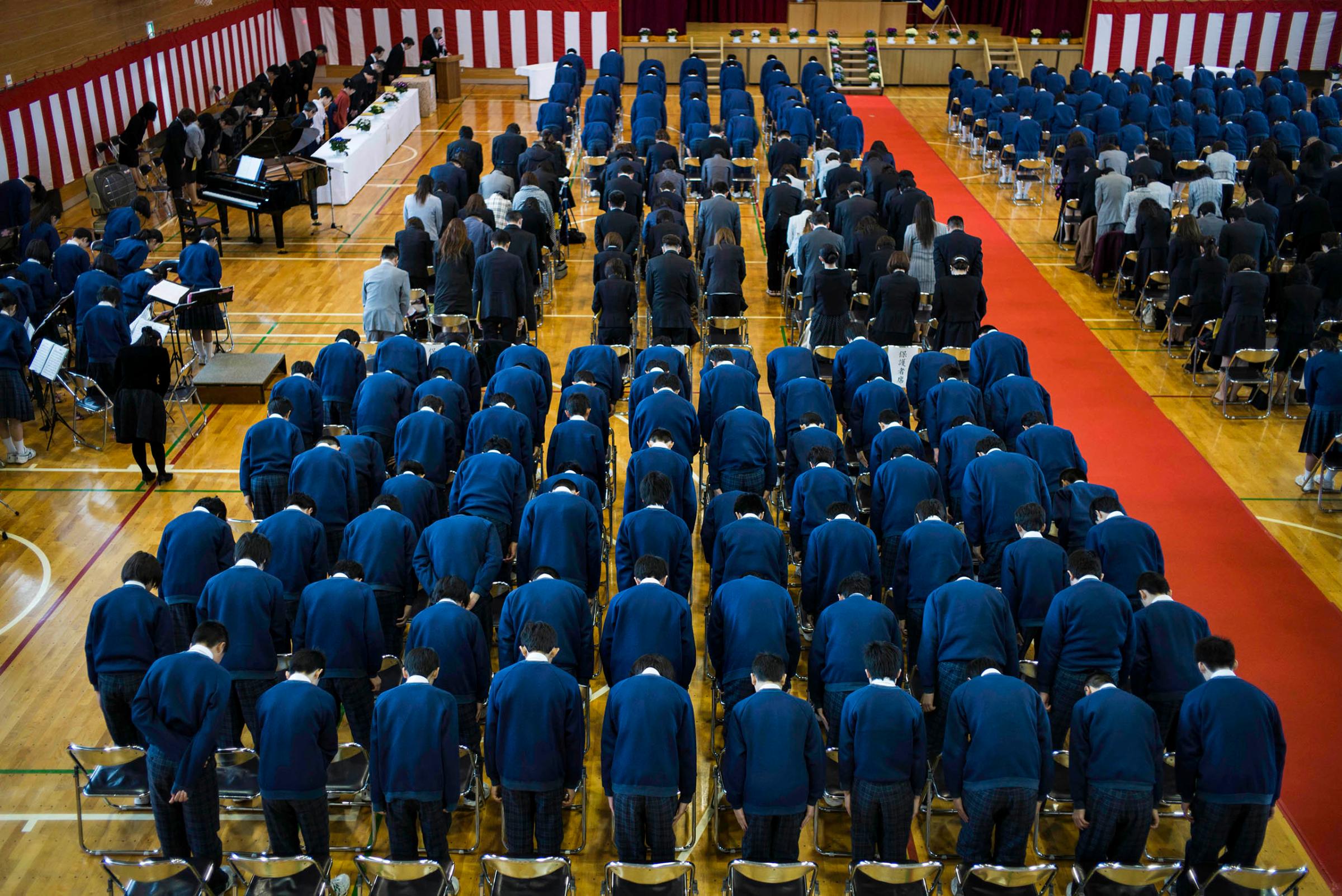 Students in the first rows prepare to graduate from Minamisoma's Ishigami Junior High School on the fifth anniversary of the massive earthquake and tsunami that struck the northeastern coast of Japan, damaging the Fukushima Daiichi nuclear power plant 25km away.