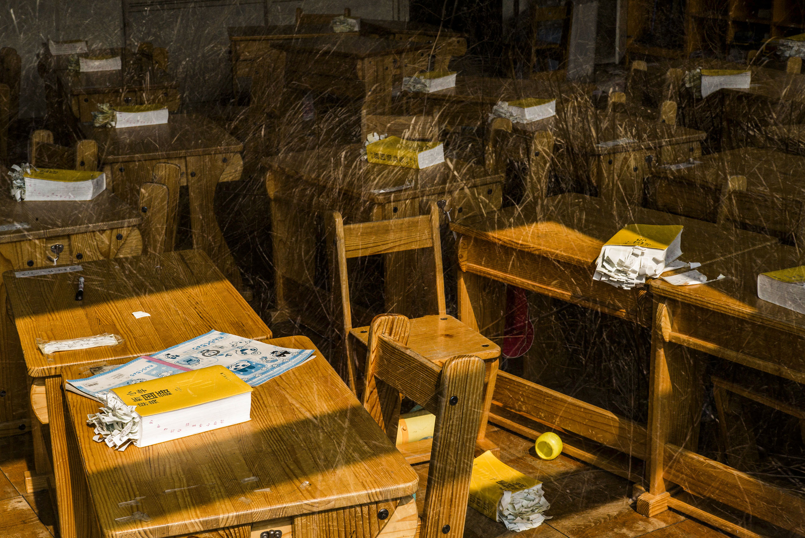 Japanese dictionaries for first-graders remain inside a classroom at the abandoned Kumano Elementary School in Okuma, Japan, March 4, 2016. The school lies within the 5km exclusion zone around the Fukushima Daiichi nuclear power plant.