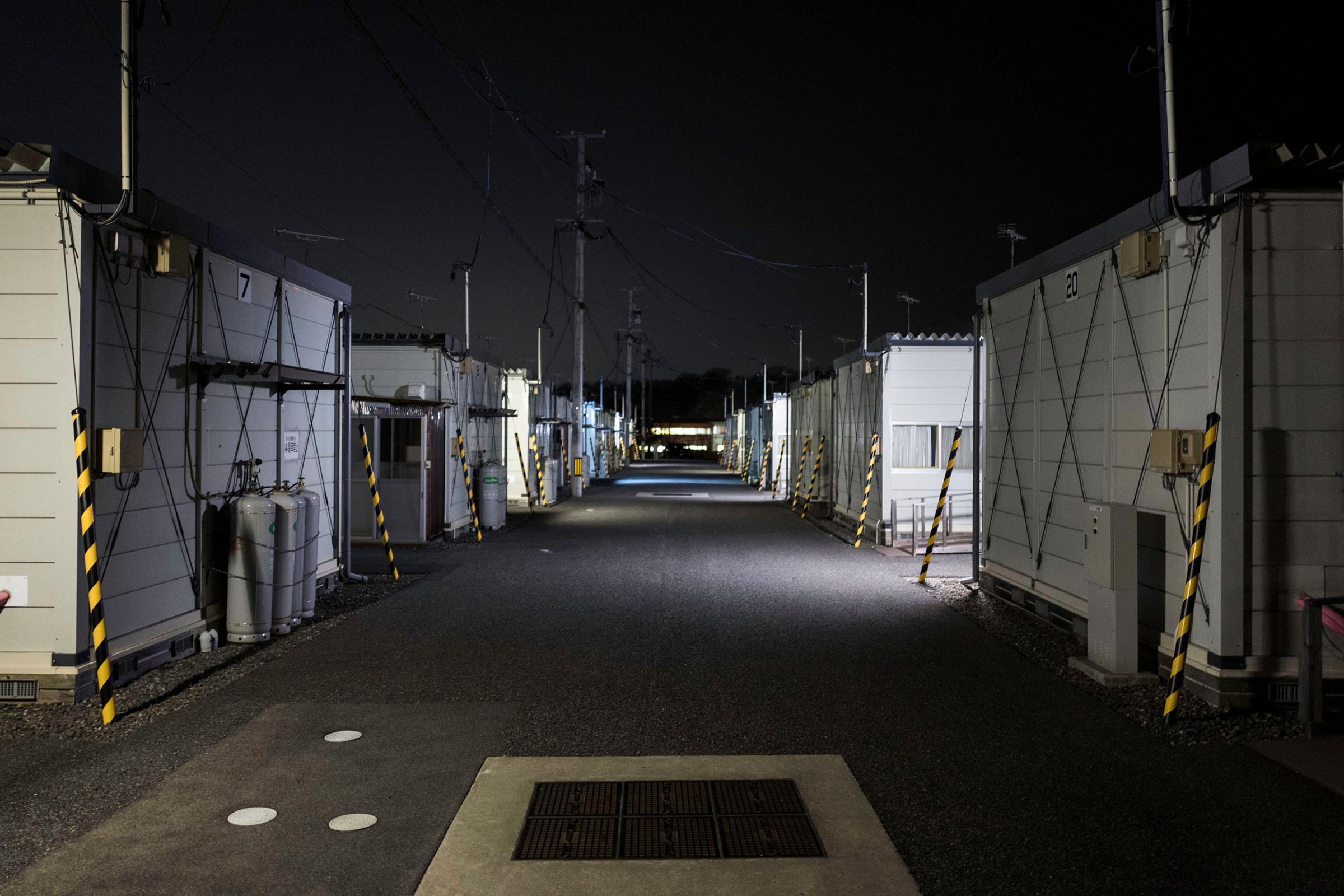 Temporary housing units are seen at night, March 4, 2016.