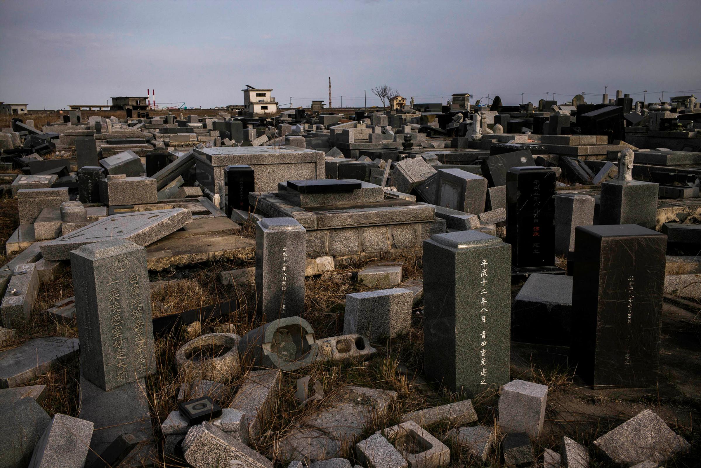 Damaged graves in Namie can be seen on the fifth anniversary of the tsunami that struck on March 11, 2011, after a massive earthquake along the northeastern coast of Japan.