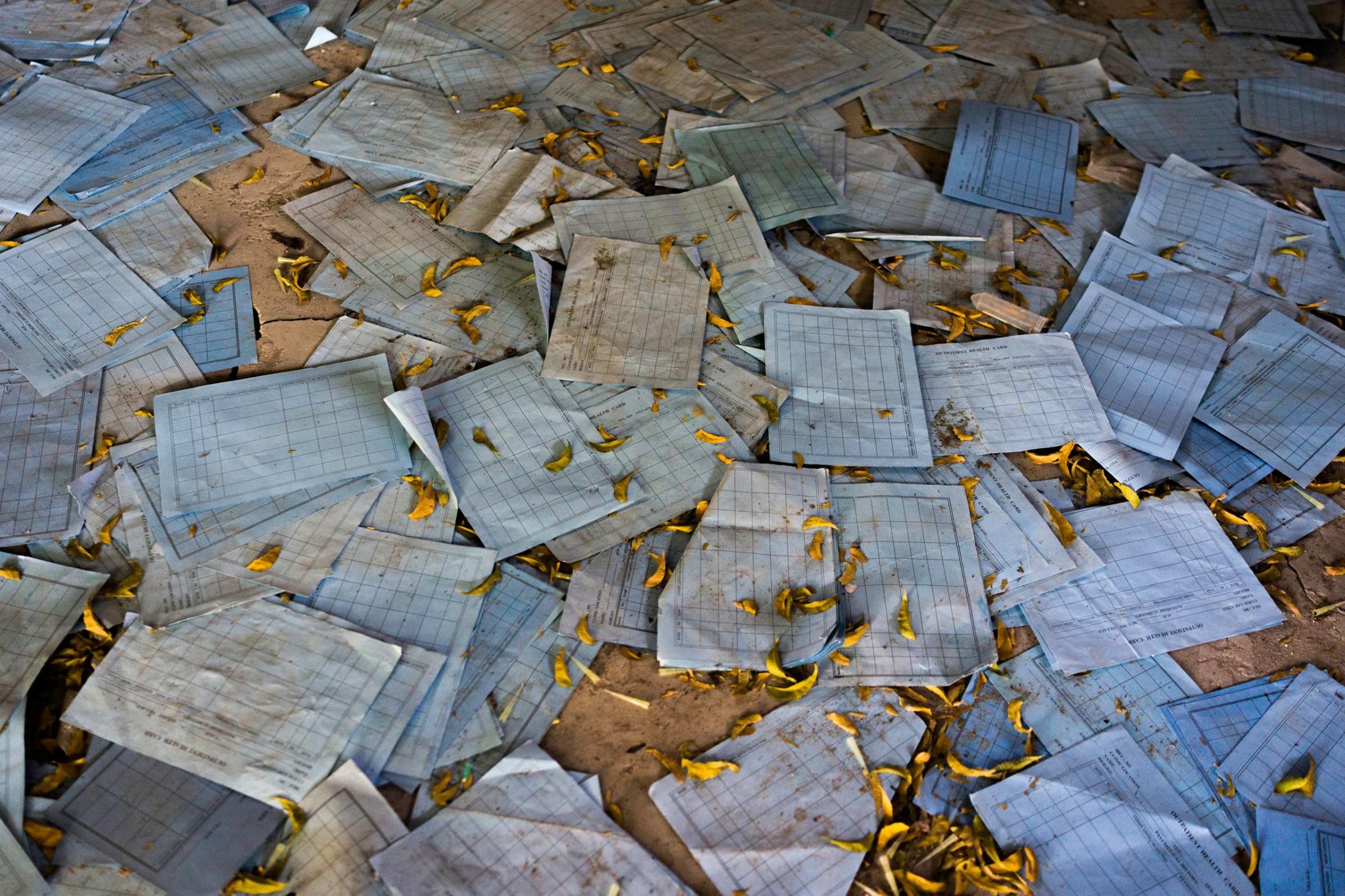 Medical charts are scattered on the ground inside the looted and abandoned Doctors Without Borders hospital in Leer, Unity State, South Sudan.