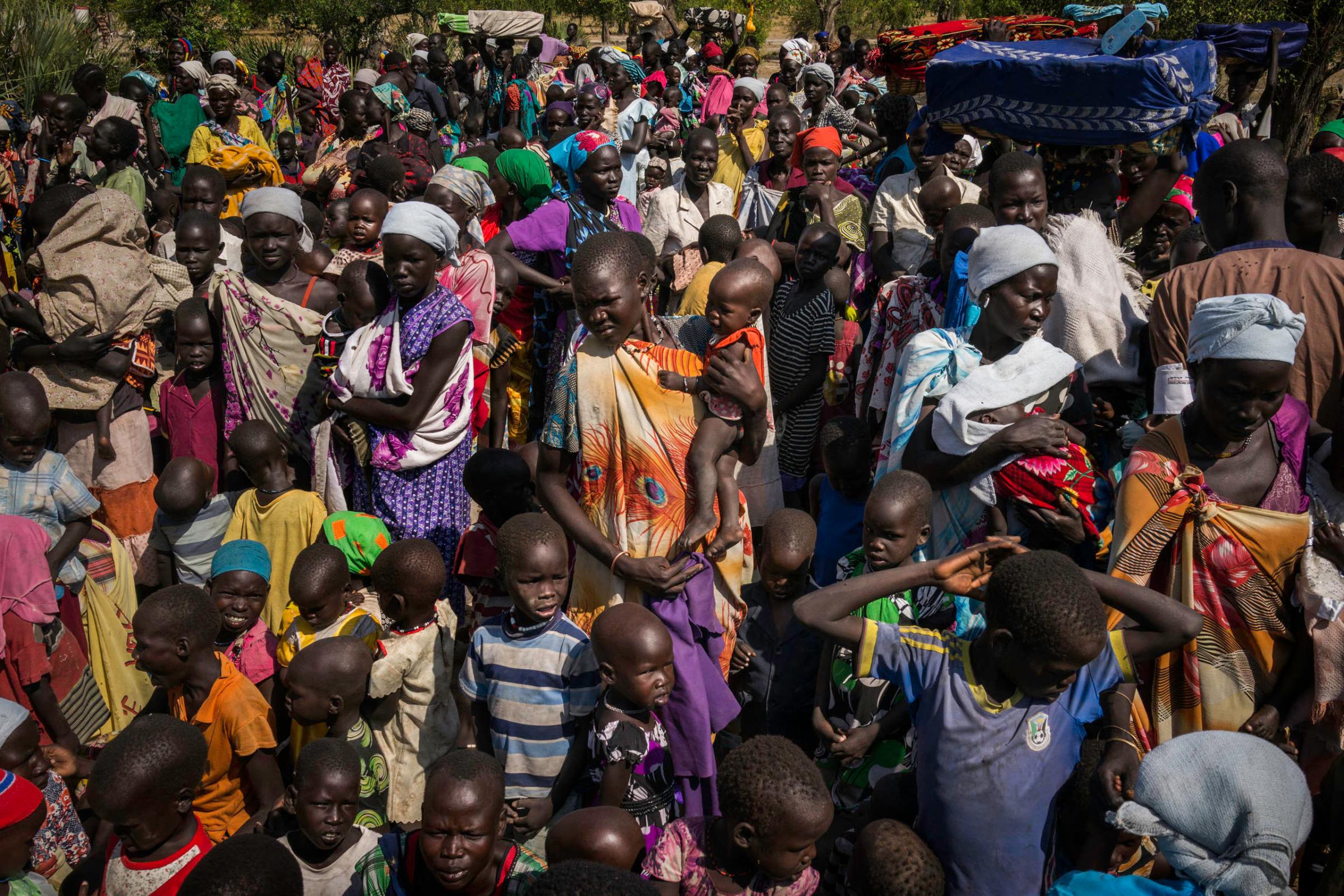 Hundreds of people receive their first distribution of food for malnourished children in Koch, Unity State, South Sudan.