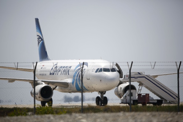 An EgyptAir Airbus A-320 sits on the tarmac of Larnaca airport after it was hijacked and diverted to Cyprus on March 29. (Behrouz Mehri—AFP/Getty Images)