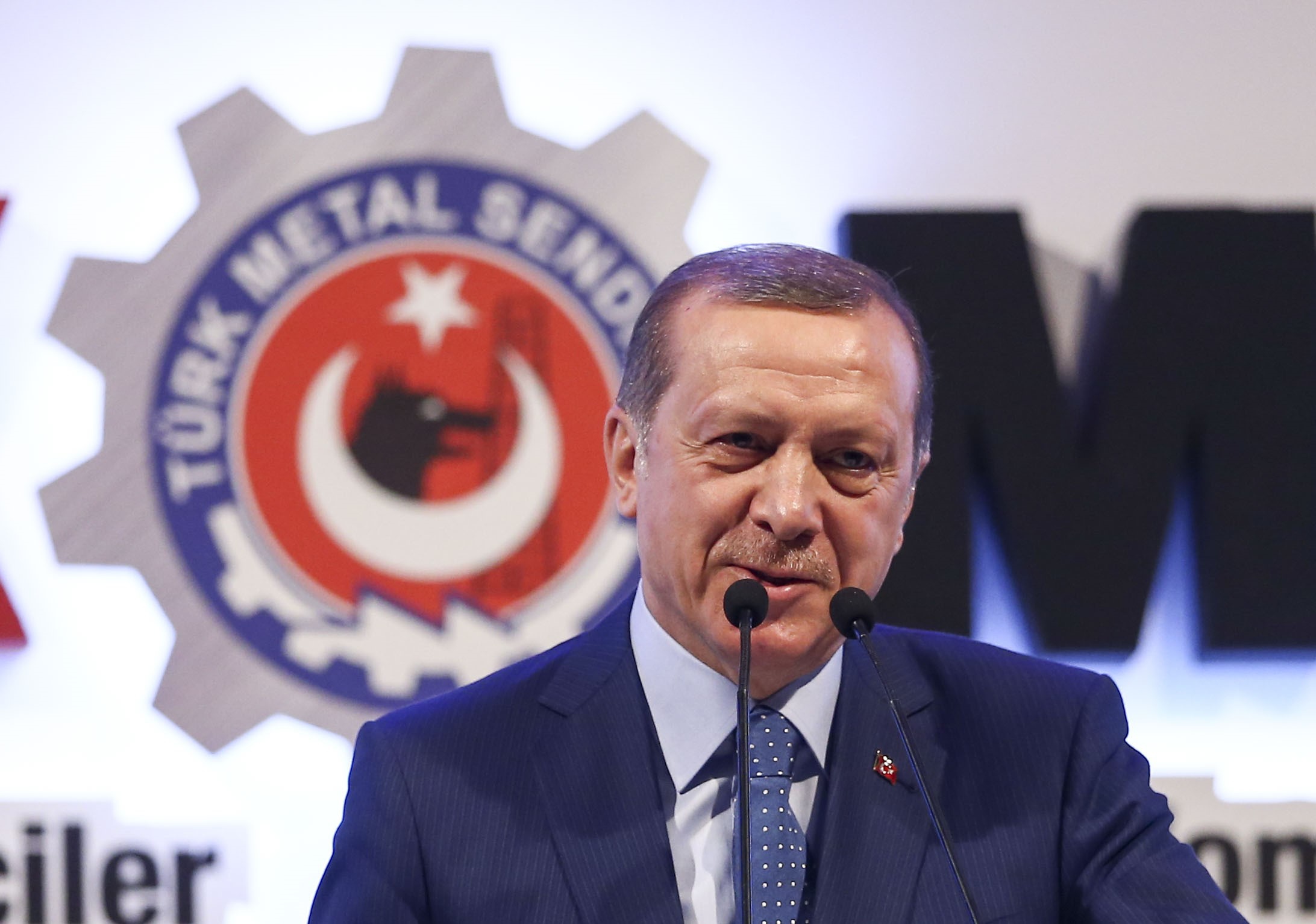 Turkish President Recep Tayyip Erdogan delivers a speech marking the International Women's Day during the 21st Women Workers' Grand Convention of metal unions in capital Ankara, Turkey on March 08, 2016.