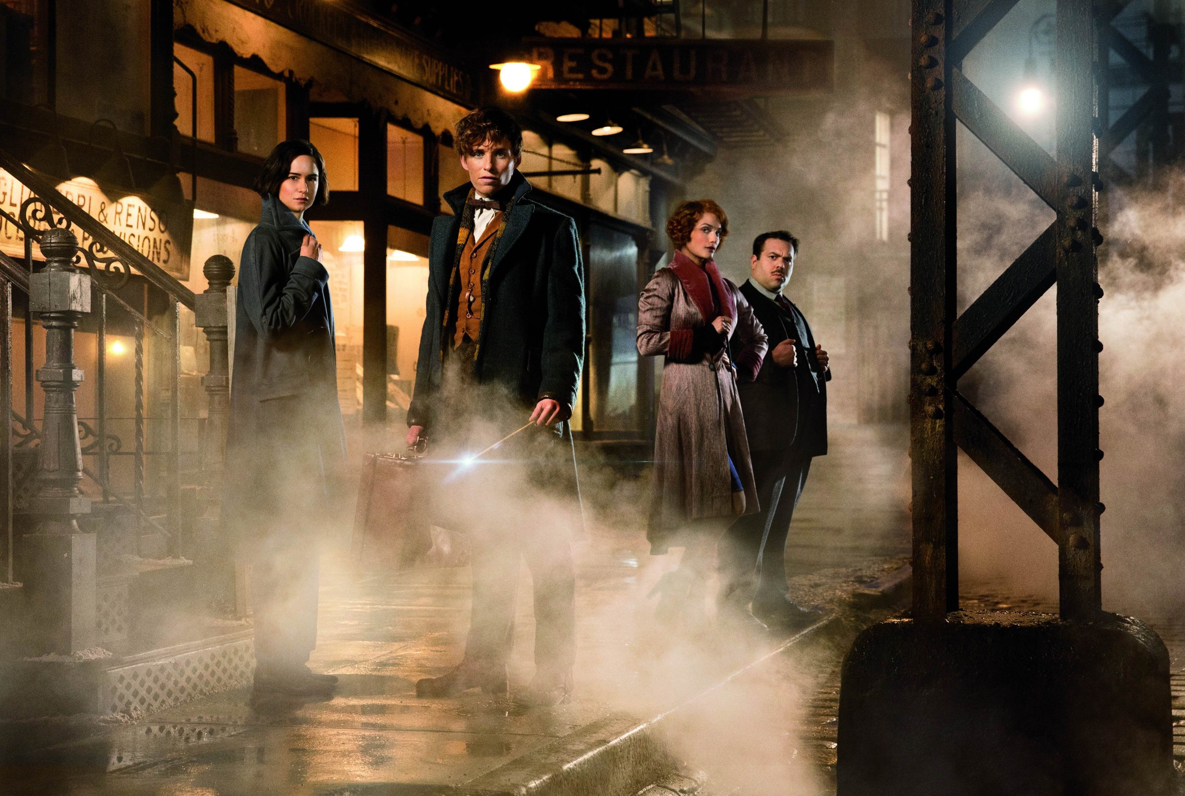 Katherine Waterston as Tina, Eddie Redmayne as Newt Scamander, AIison Sudol as Queenie and Dan Fogler as Jacob in Warner Bros. Pictures' fantasy adventure "Fantastic Beasts and Where to Find Them."