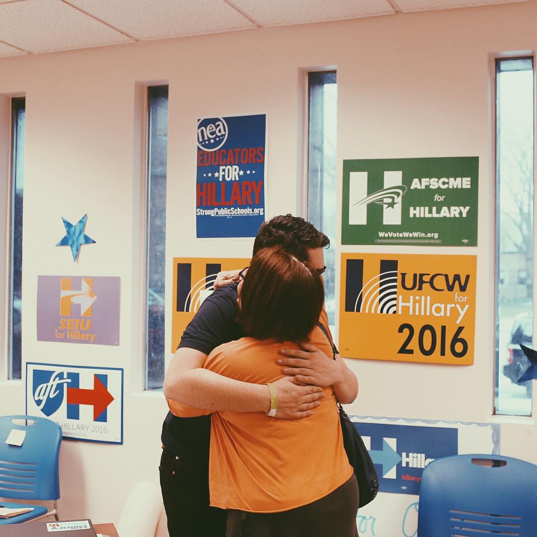 Benita Kahn, right, hugs Clinton campaign fellow Harrison Bronfeld at the Hillary Clinton Campaign Office before phone banking in Columbus, Ohio on March 15.