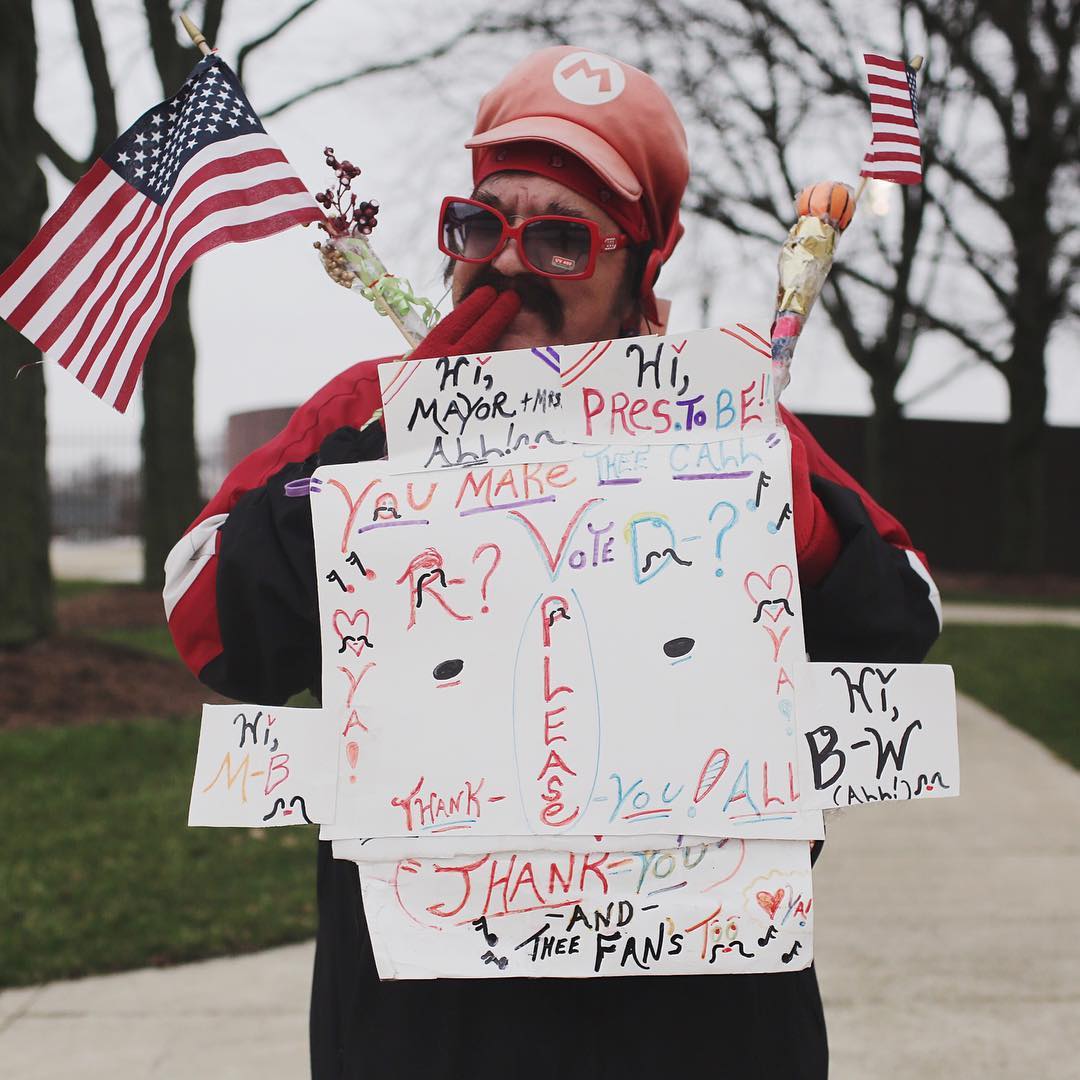 Pasquale Mann promotes a number of voting choices on the campus of Baldwin-Wallace University in Berea, Ohio, where John Kasich is schedule for an event in the evening of March 15.