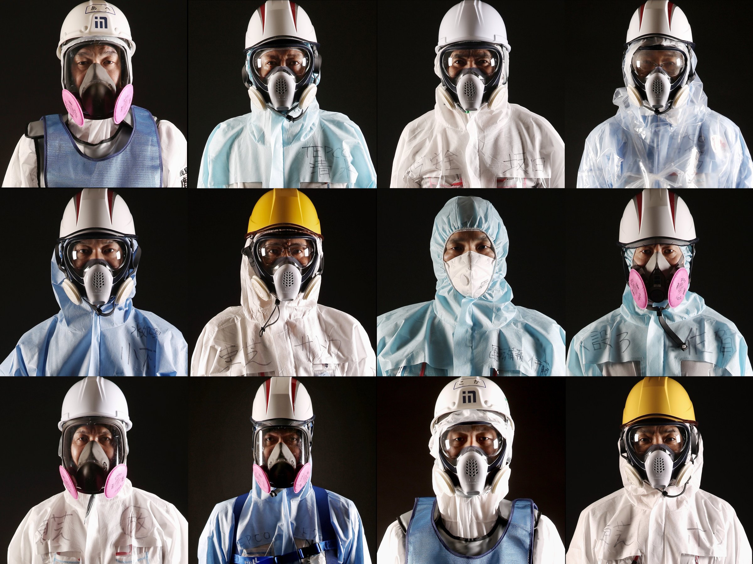Workers of TEPCO and the Kajima Corporation pose for portraits at the Fukushima Daiichi nuclear power plant in Okuma, Japan, Feb. 23, 2016. March 11 marks the fifth anniversary of the 9.0-magnitude earthquake and tsunami that killed some 16,000 people, as well as the subsequent damage to the reactors at TEPCO's Fukushima Daiichi Nuclear Power Plant.