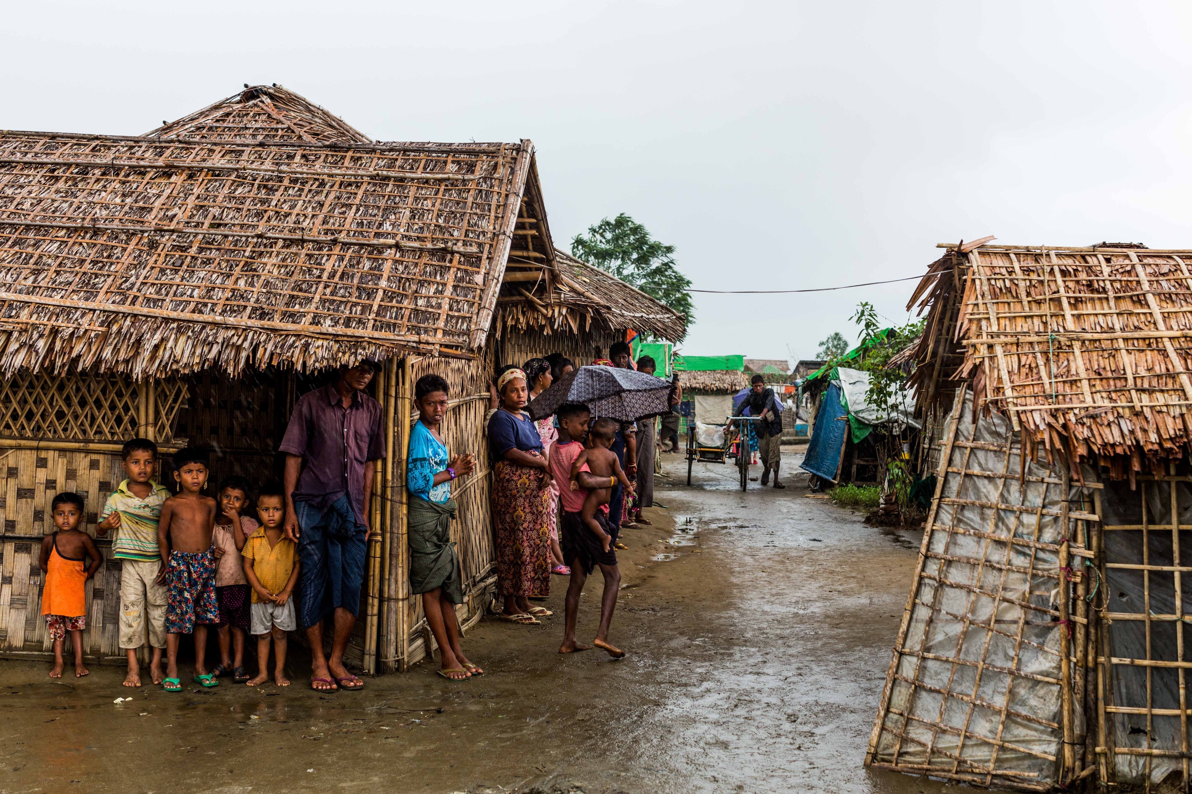 Rohingya refugees seek shelter from the monsoon rains inside a camp for internally displaced persons outside Sittwe, in Burma's Rakhine state, on July 17, 2015 (Asanka Brendon Ratnayake—Anadolu Agency/Getty Images)