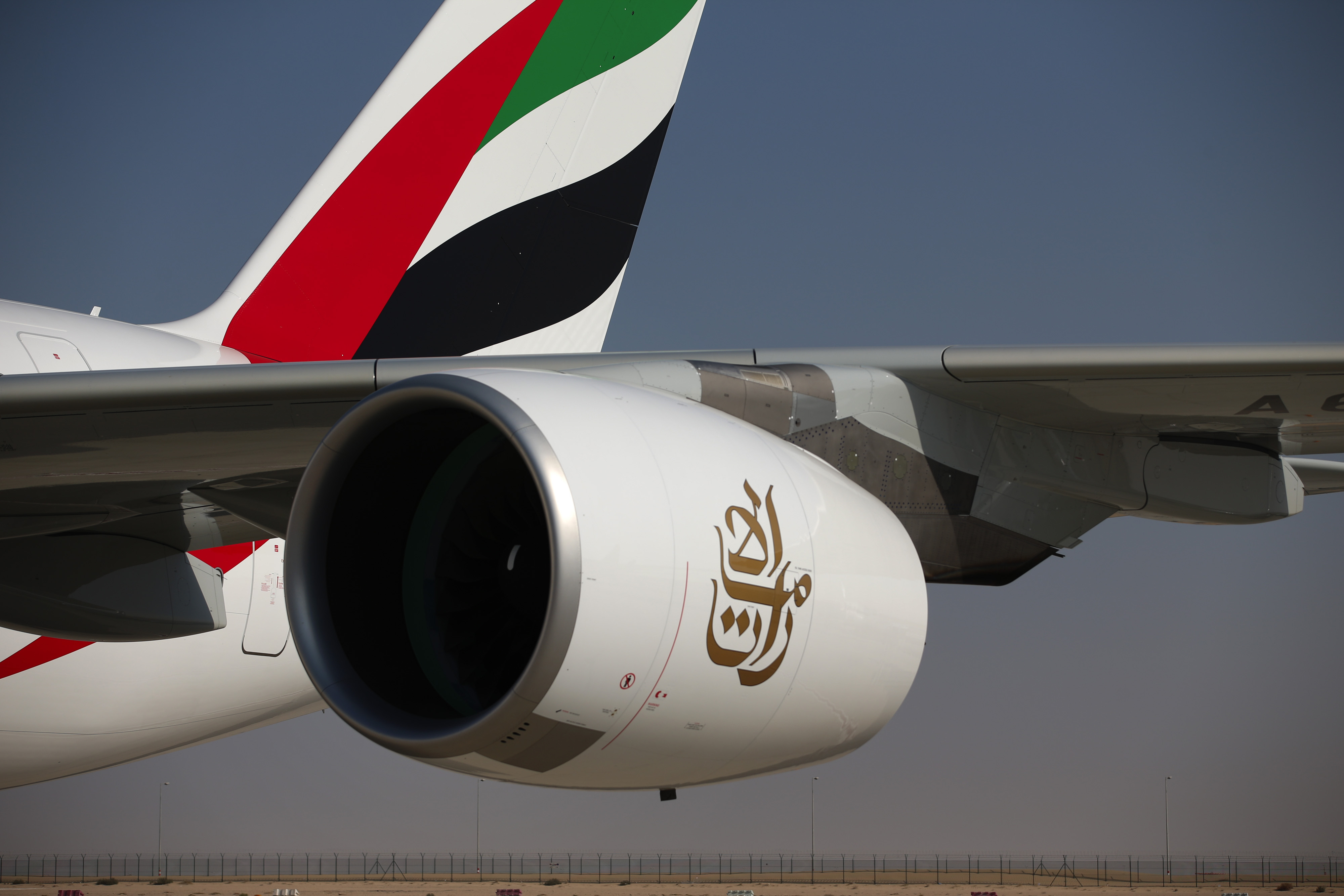 The engine of an Airbus SAS A380-800 aircraft hangs from the wing of an Emirates Airline aircraft on the opening day of the 14th Dubai Air Show in Dubai on Nov. 8, 2015 (Bloomberg/Getty Images)