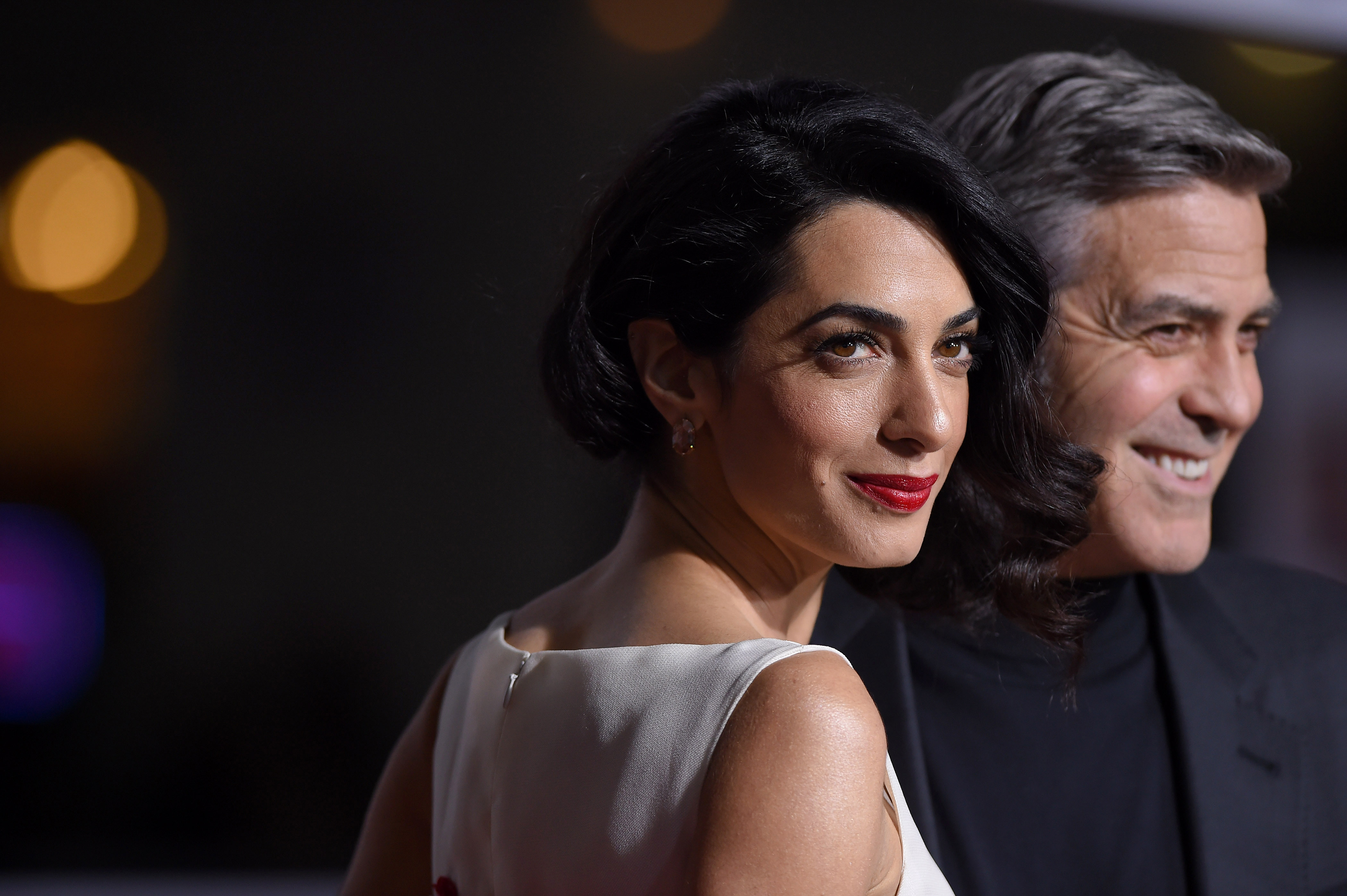 Lawyer Amal Clooney and actor George Clooney arrive at the premiere of <i>Hail, Caesar!</i> at Regency Village Theatre on Feb. 1, 2016, in Westwood, Calif. (Axelle/Bauer-Griffin—FilmMagic)