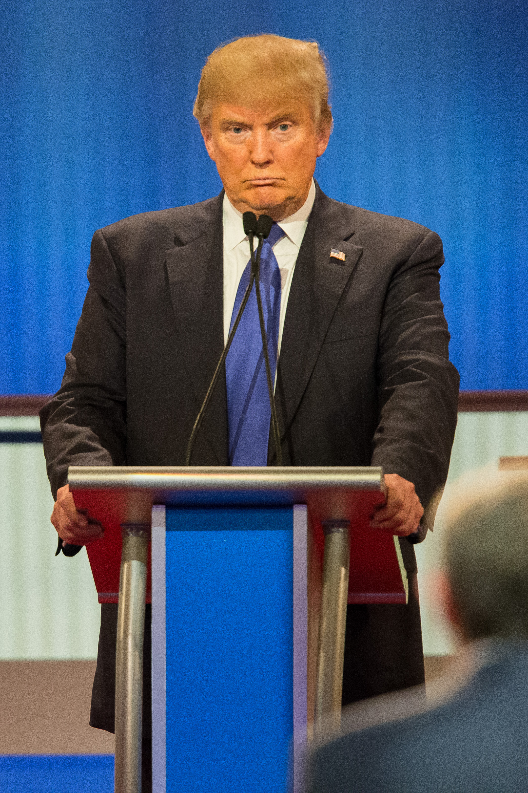 Republican Presidential candidate Donald Trump reacts to a question during the Republican Presidential Debate in Detroit, Michigan, March 3, 2016. (Geoff Robins—AFP/Getty Images)