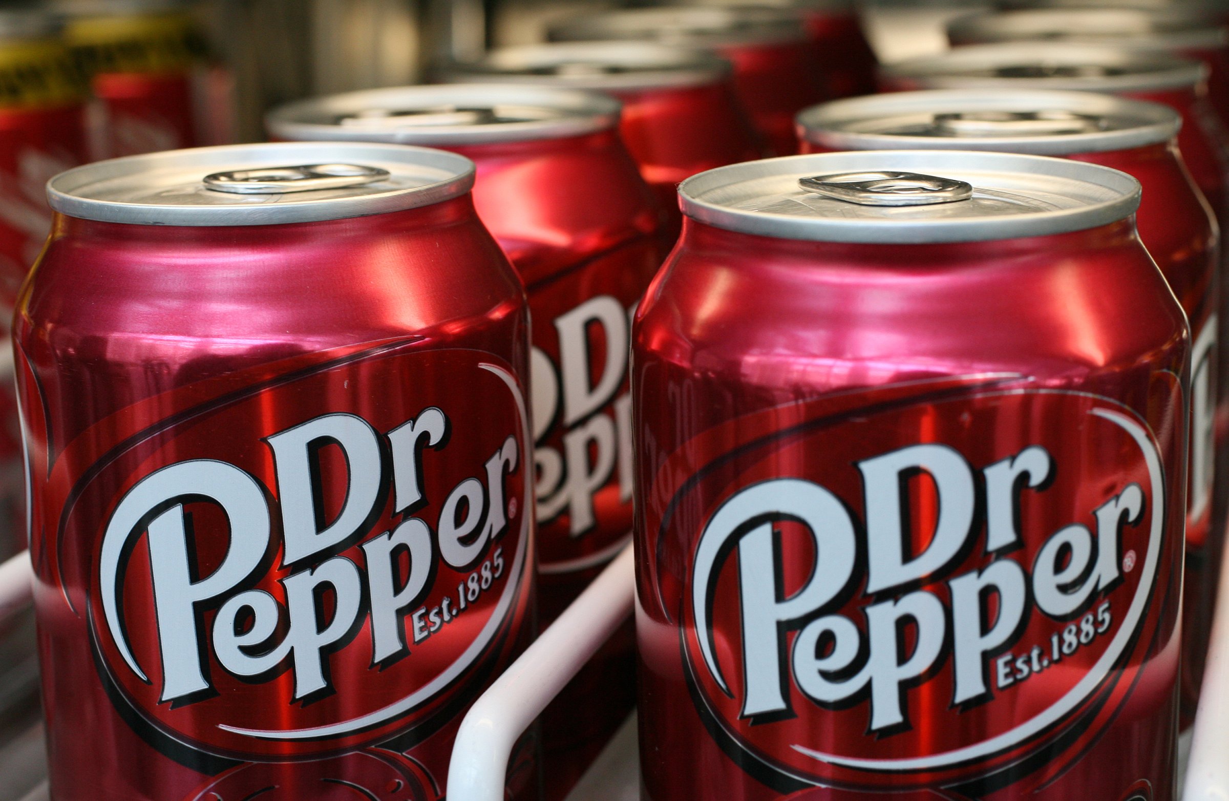 Cans of Dr Pepper sit on a pantry shelf in New York, Tuesday